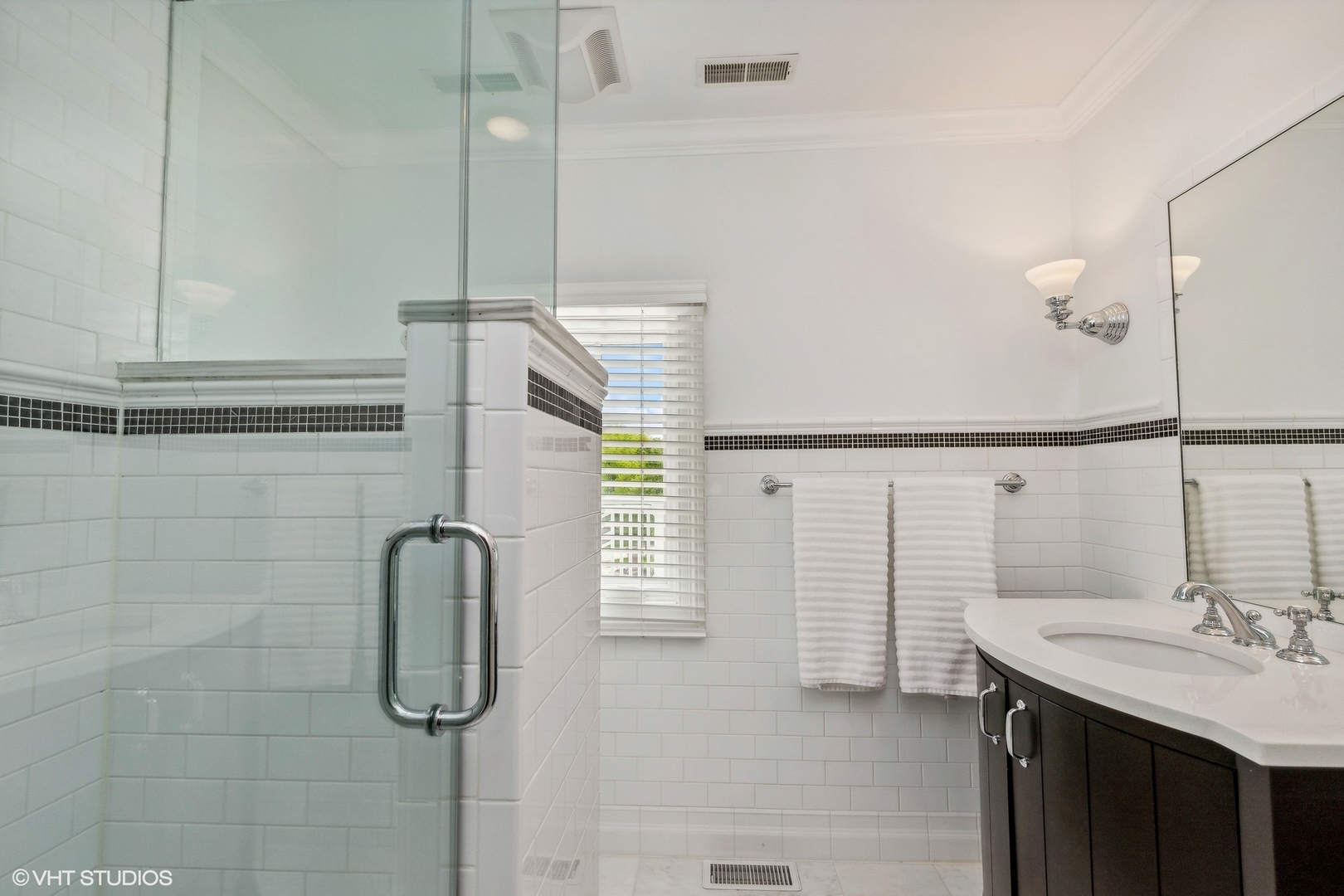 650 East Deerpath Road Lake Forest, IL 60045 - Photo 28 of 45 a bathroom with a sink and mirror