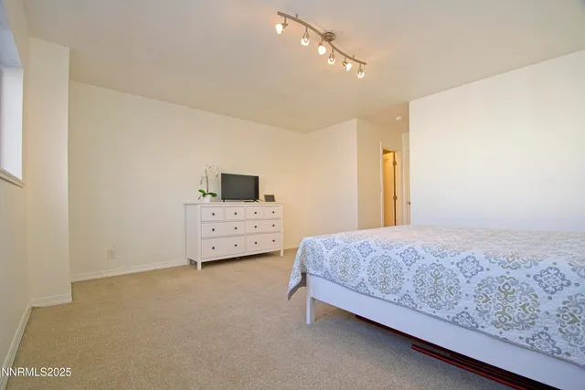 a bedroom with a bed and a cabinets
