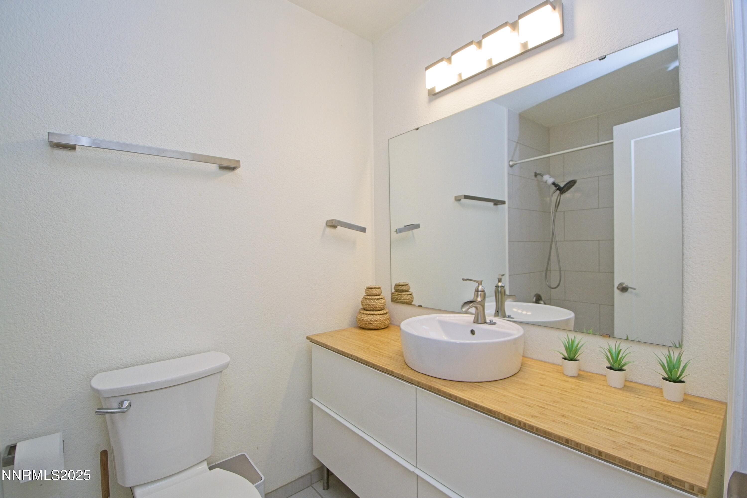 125 Mary Street, Unit A Reno, NV 89509 - Photo 15 of 22 a bathroom with a sink a toilet and shower