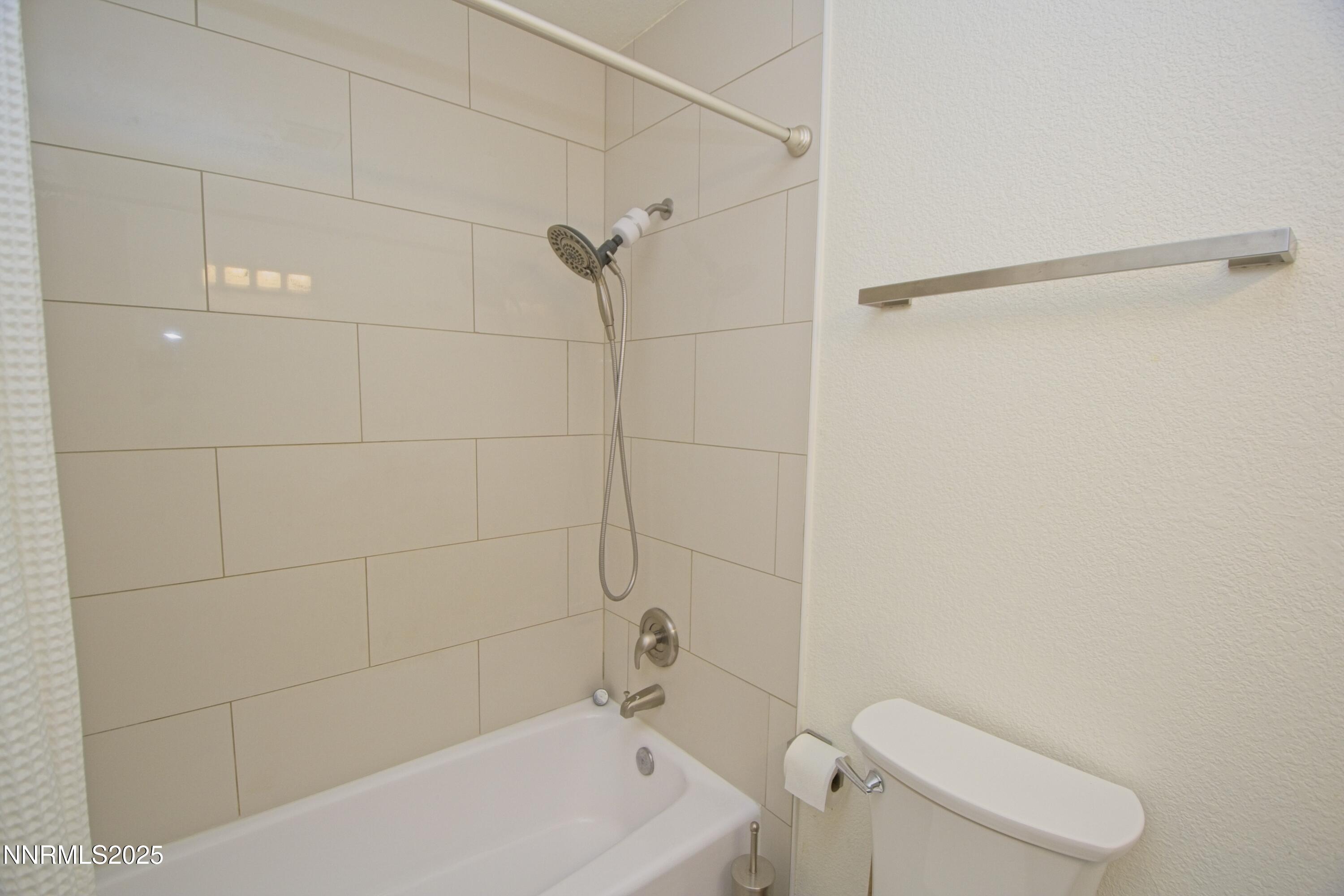 125 Mary Street, Unit A Reno, NV 89509 - Photo 16 of 22 a bathroom with a shower and toilet