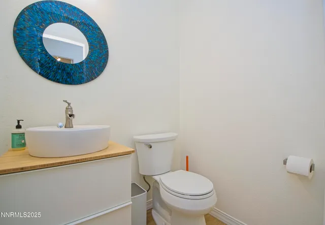 a bathroom with a toilet and a sink
