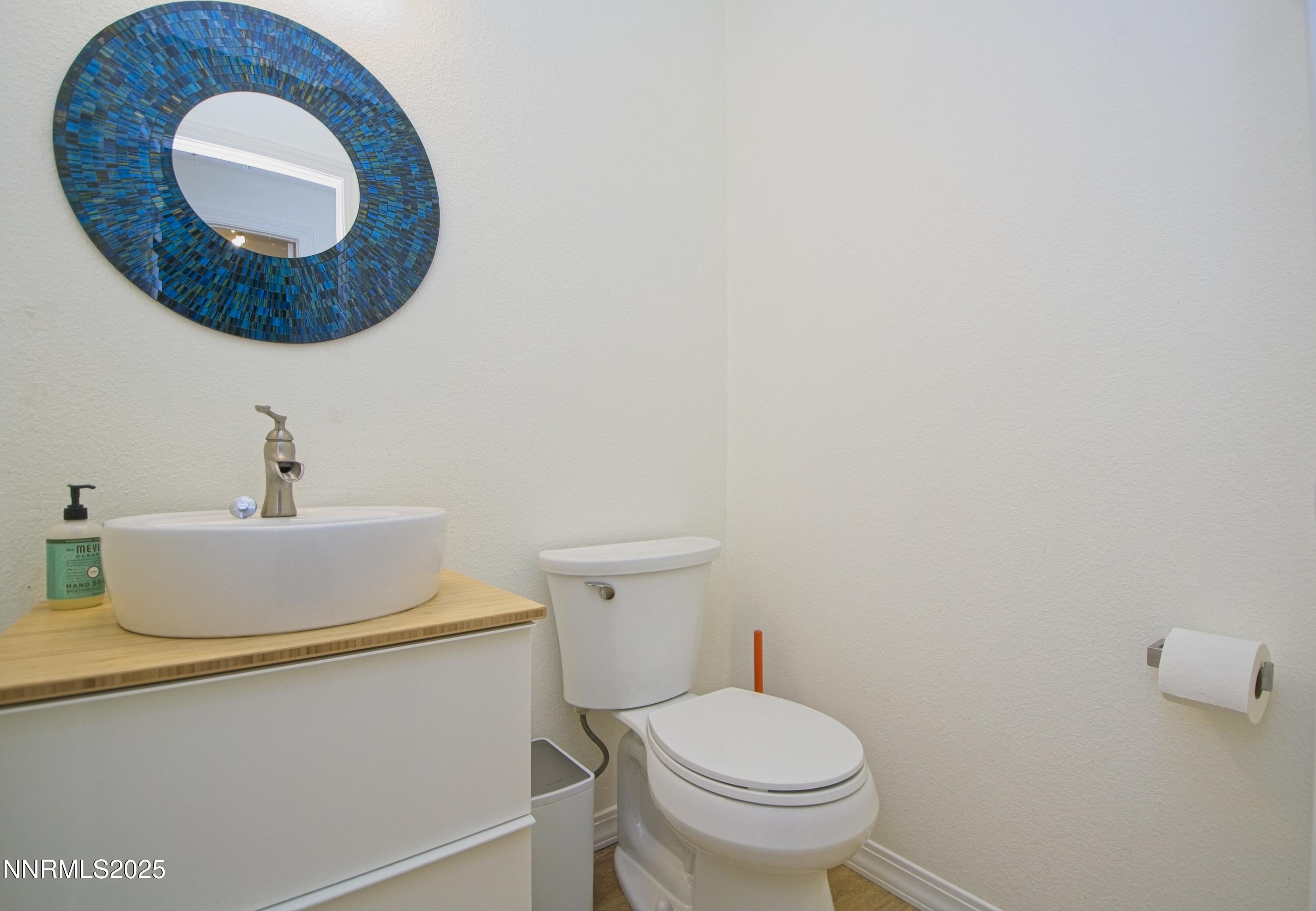 125 Mary Street, Unit A Reno, NV 89509 - Photo 17 of 22 a bathroom with a toilet and a sink