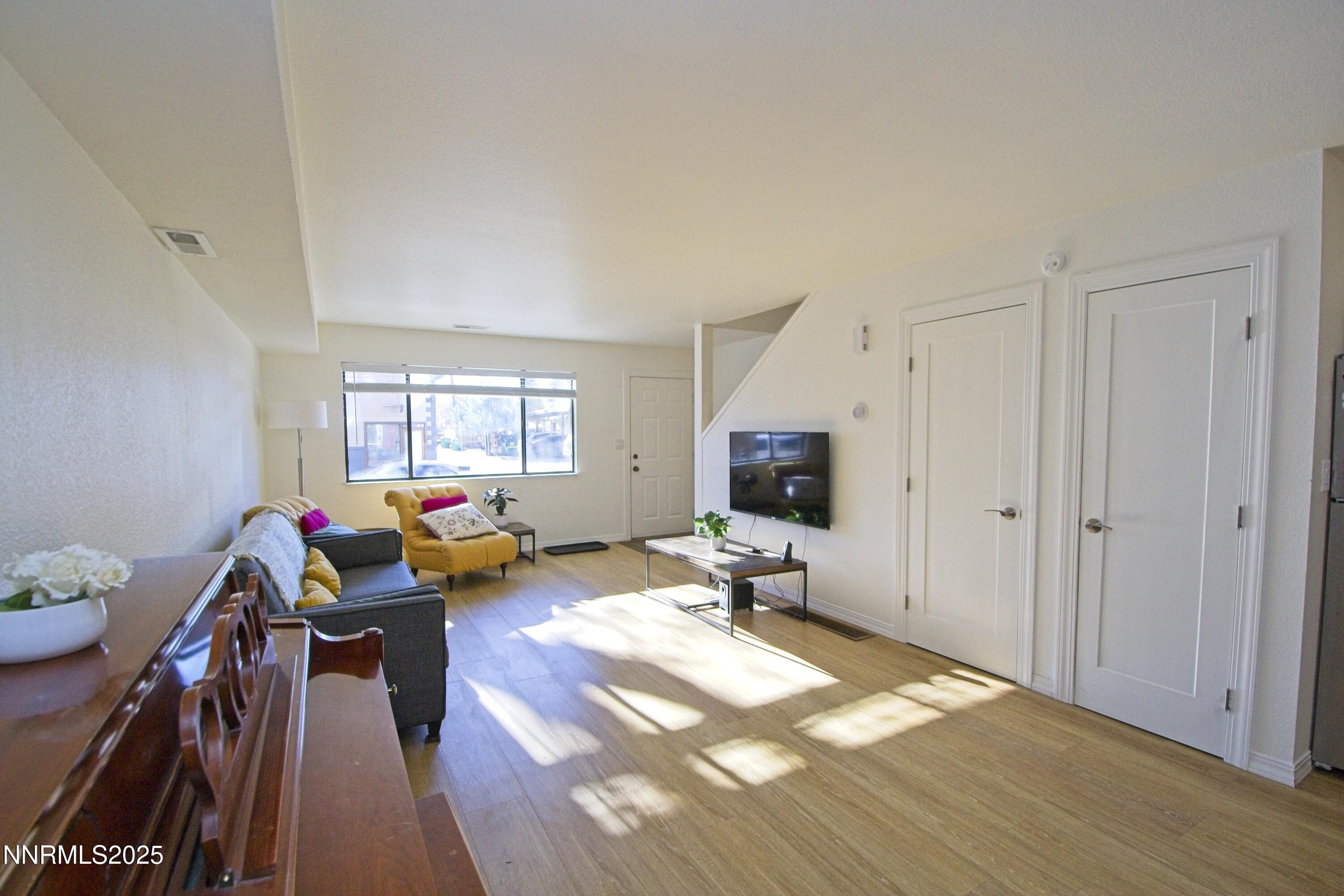 125 Mary Street, Unit A Reno, NV 89509 - Photo 4 of 22 a living room with furniture and a wooden floor