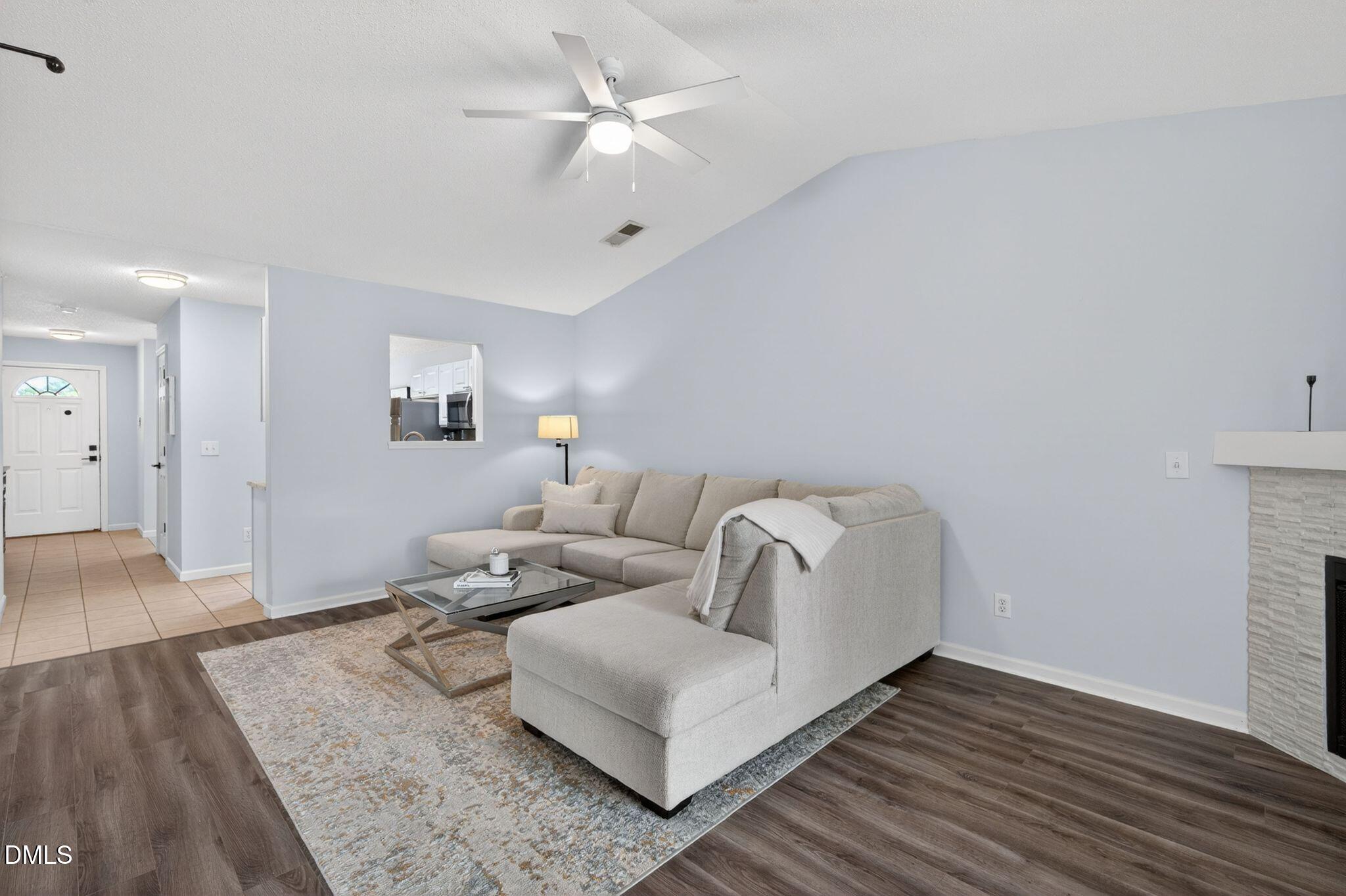 2400 Huntscroft Lane, Unit 202 Raleigh, NC 27617 - Photo 9 of 49 a living room with furniture and a wooden floor