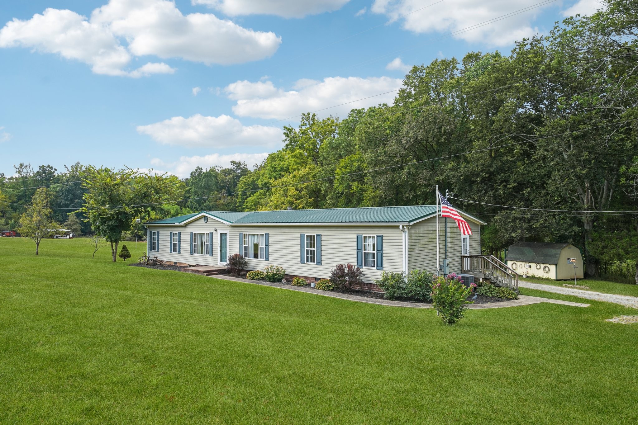 1765 Williamson Branch Road Vanleer, TN 37181 - Photo 15 of 59 a view of a house with a backyard and a patio