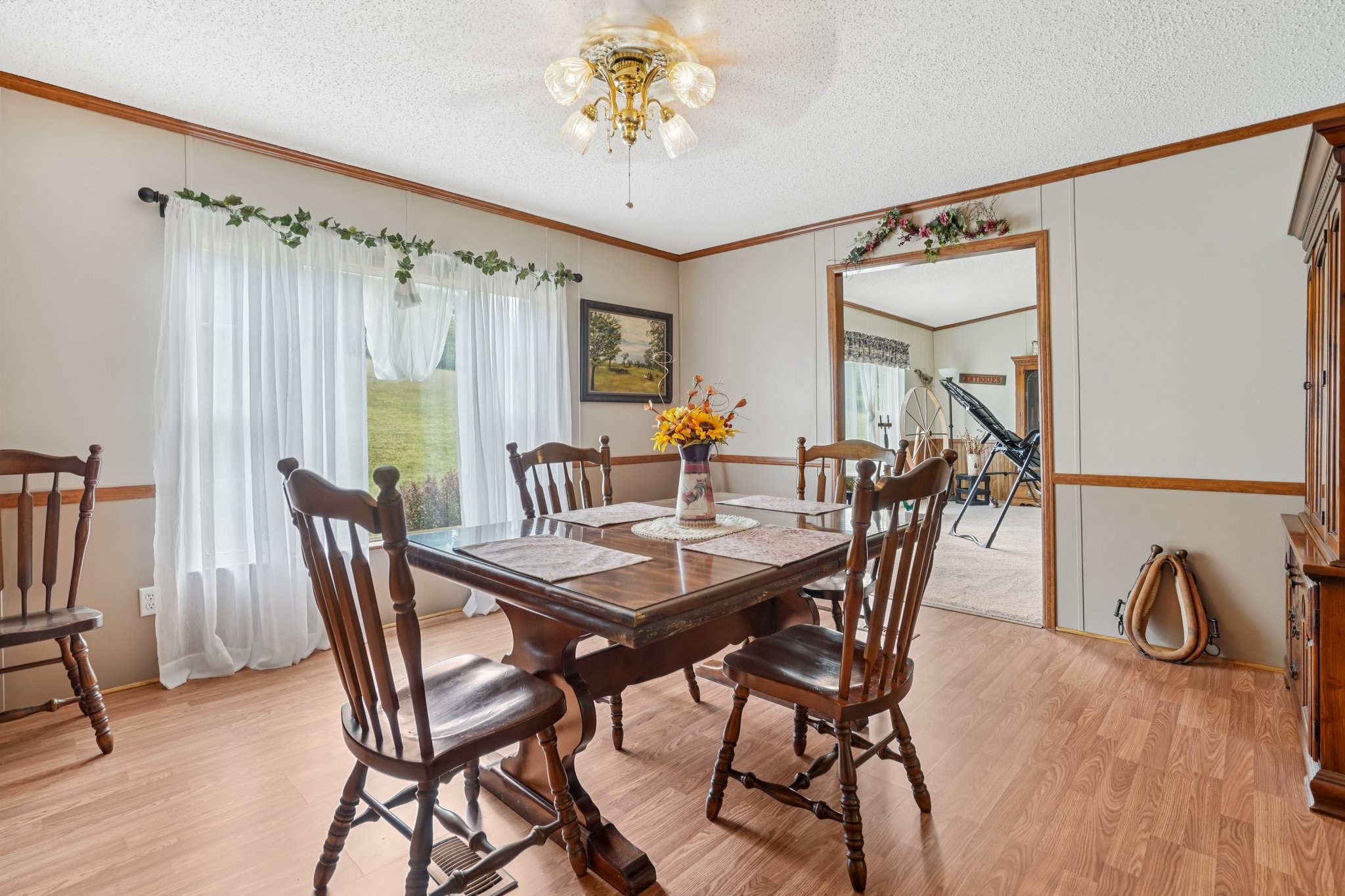 1765 Williamson Branch Road Vanleer, TN 37181 - Photo 17 of 59 a view of a dining room with furniture window and wooden floor