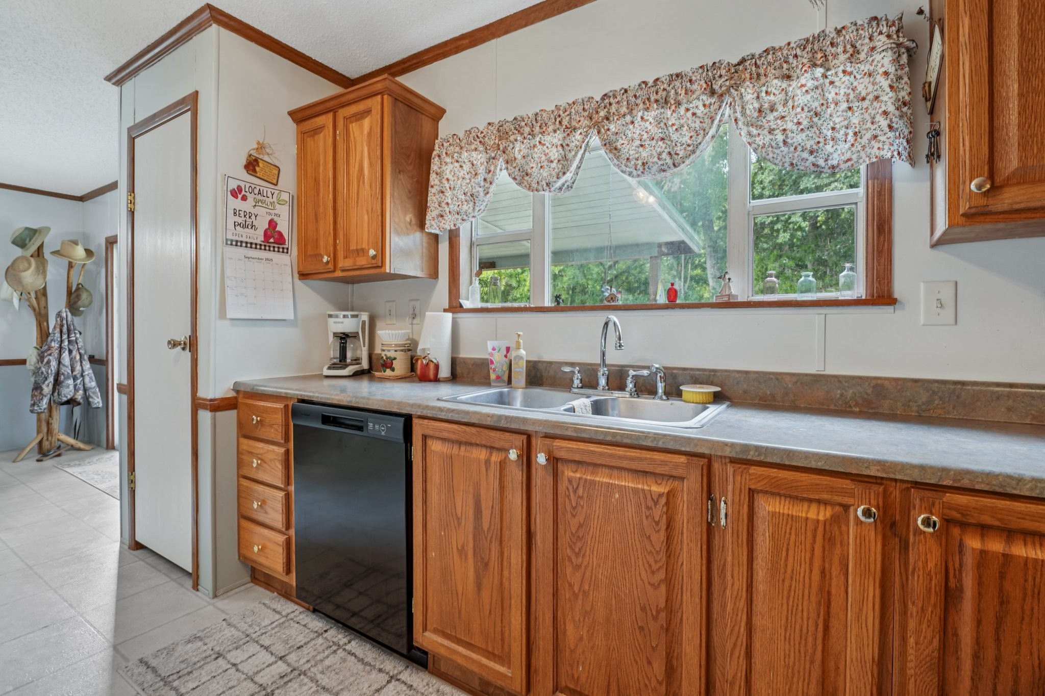 1765 Williamson Branch Road Vanleer, TN 37181 - Photo 20 of 59 a kitchen with stainless steel appliances a sink cabinets and a window