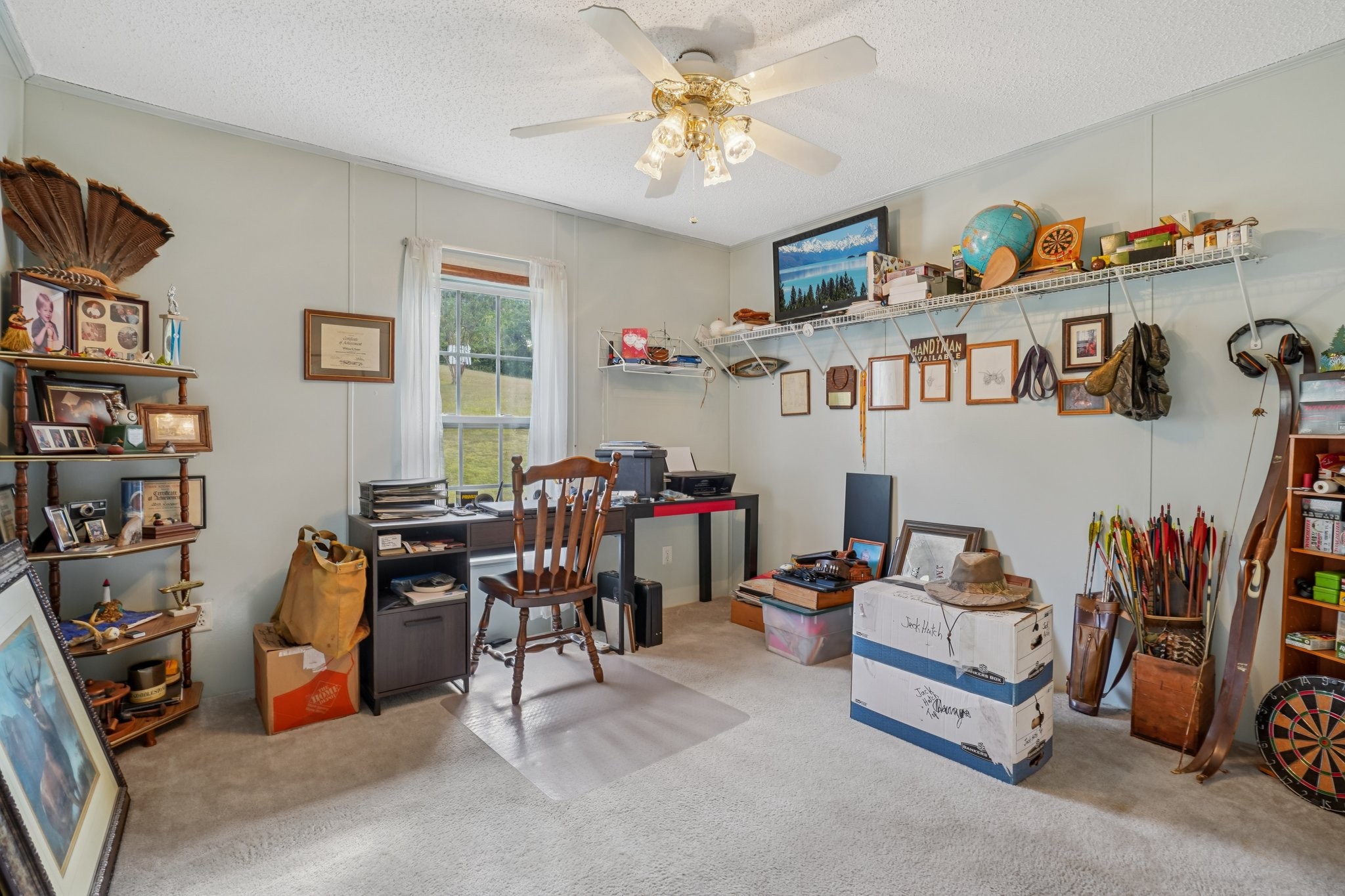 1765 Williamson Branch Road Vanleer, TN 37181 - Photo 26 of 59 a living room with lots of furniture and gym equipment