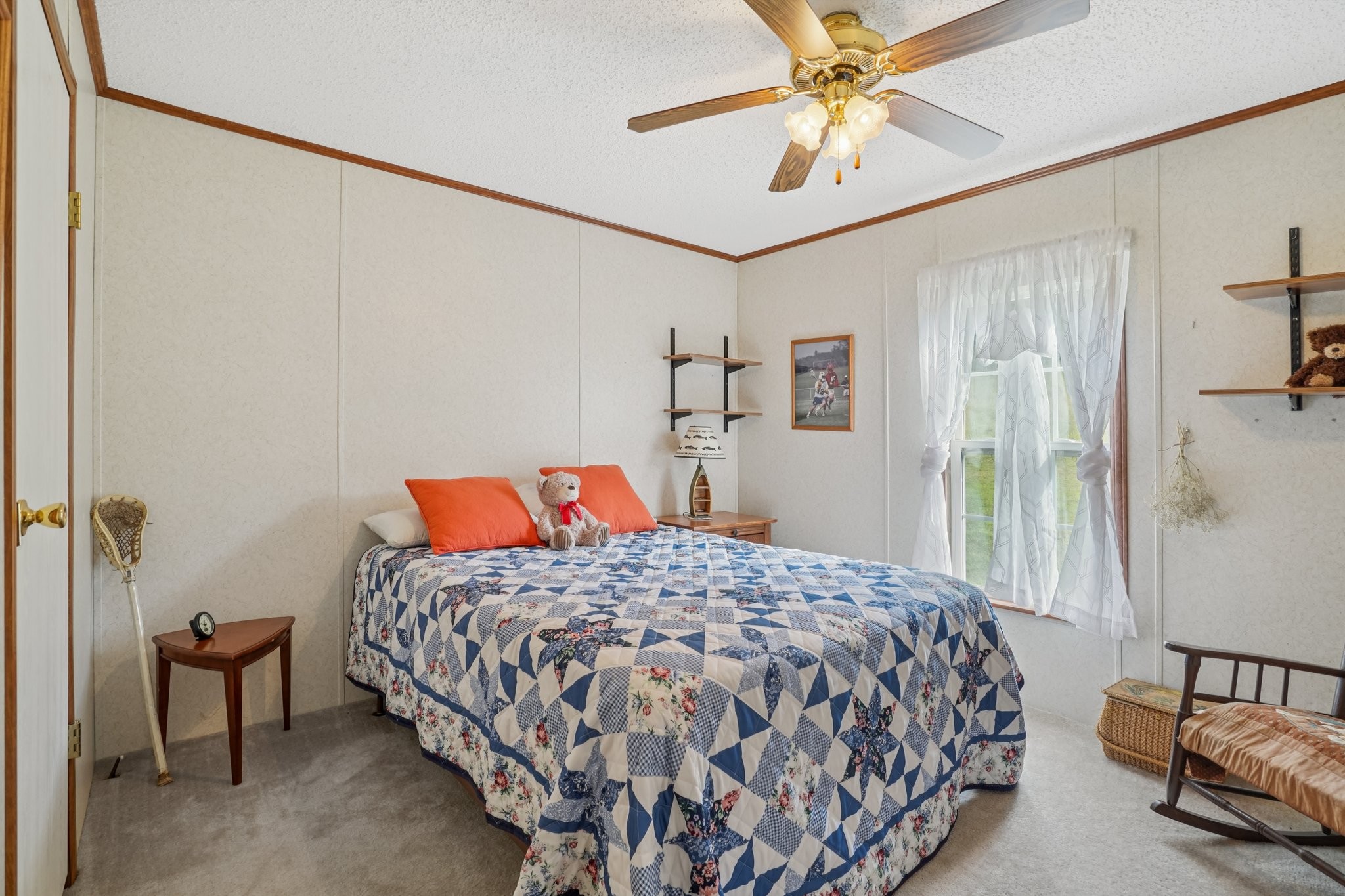 1765 Williamson Branch Road Vanleer, TN 37181 - Photo 28 of 59 a bedroom with a bed and a chandelier