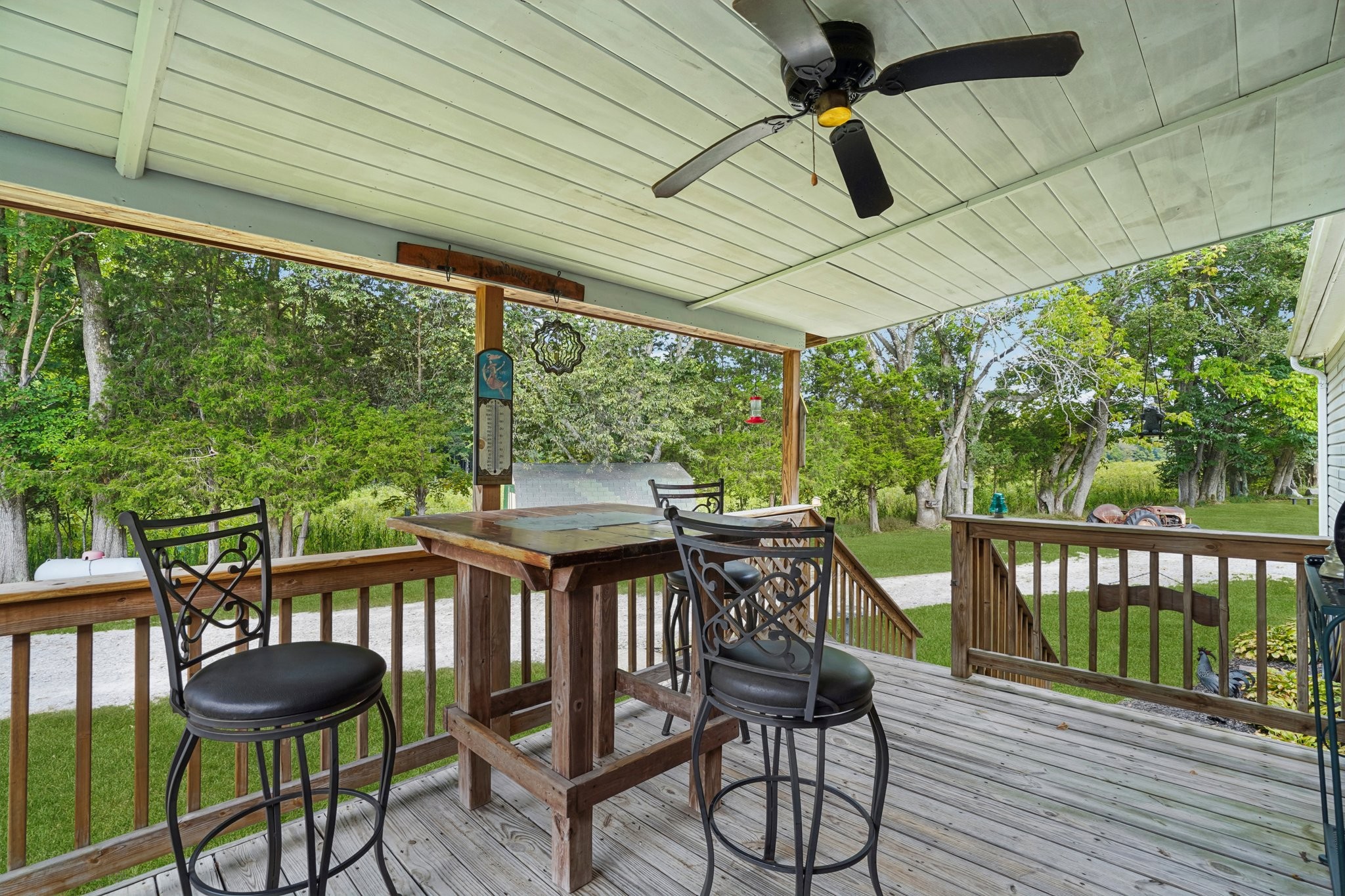 1765 Williamson Branch Road Vanleer, TN 37181 - Photo 3 of 59 a table and chairs in front of a house