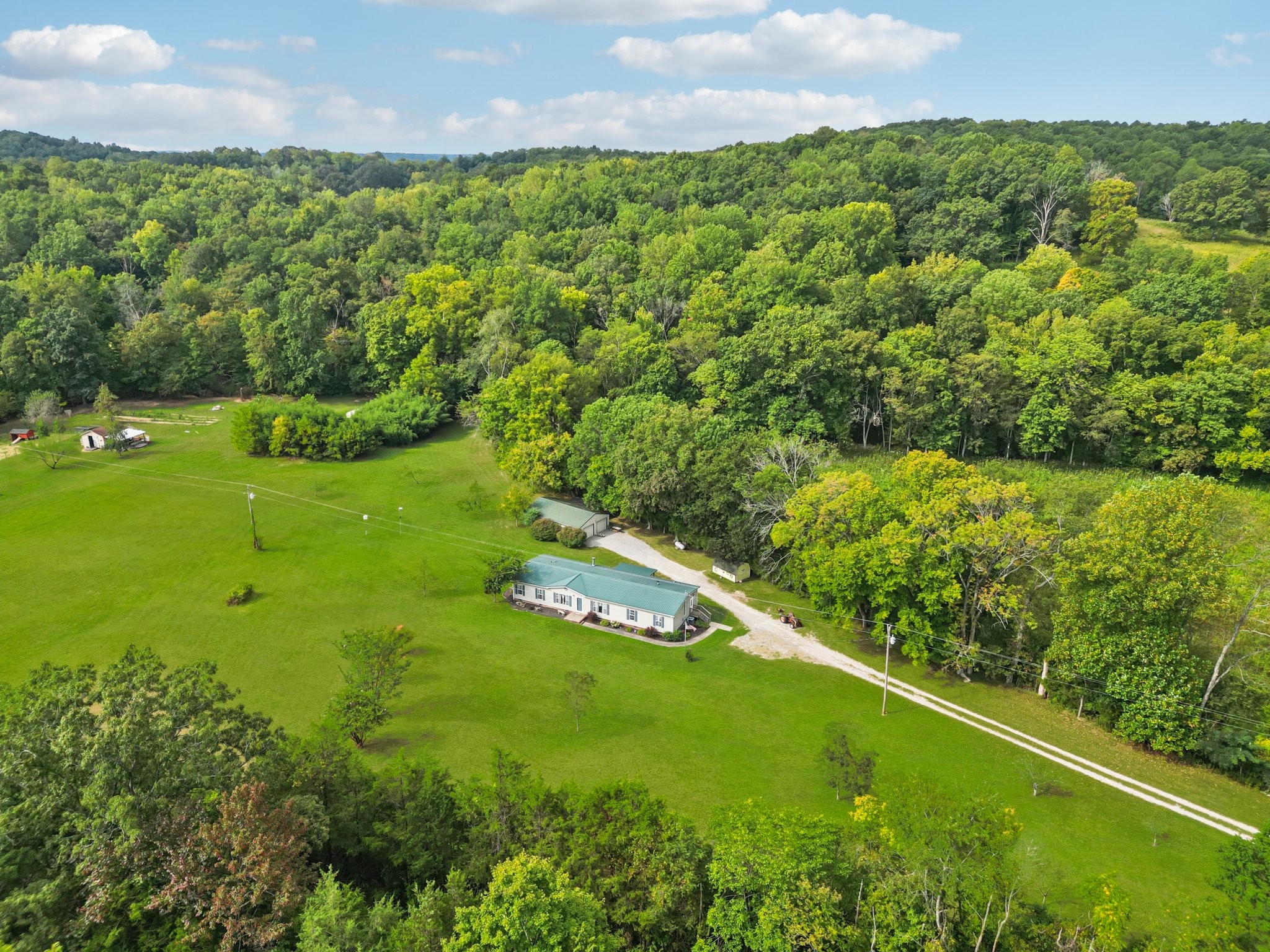 1765 Williamson Branch Road Vanleer, TN 37181 - Photo 35 of 59 a view of a garden with a building in the background