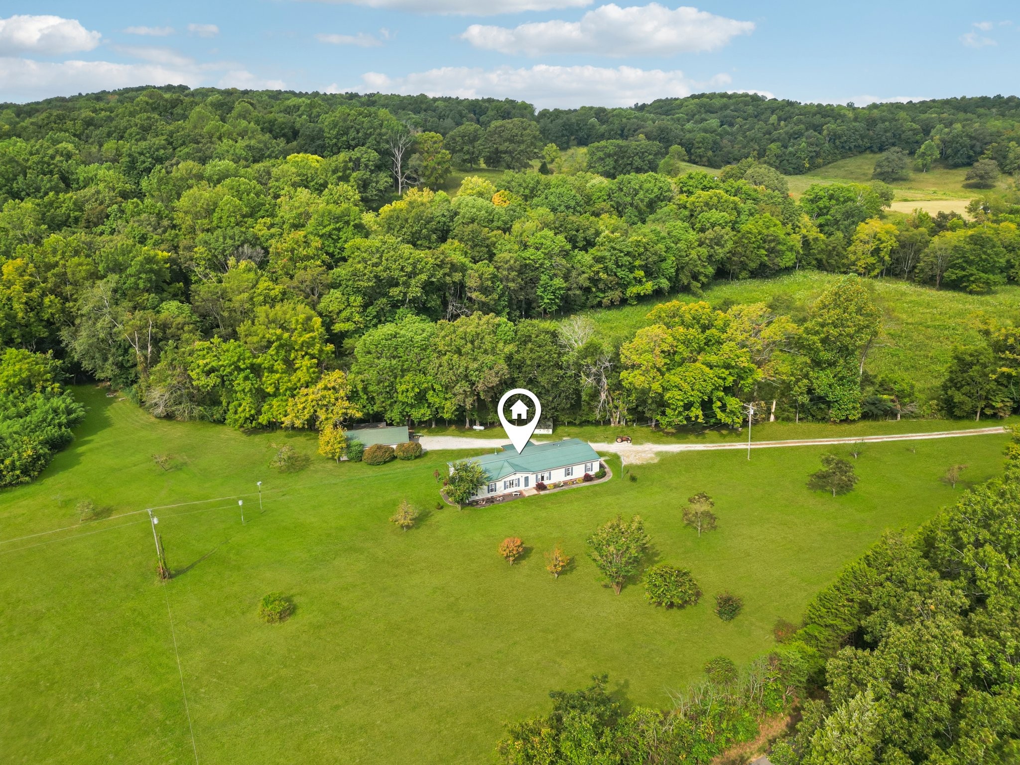 1765 Williamson Branch Road Vanleer, TN 37181 - Photo 38 of 59 a view of a city with lush green forest