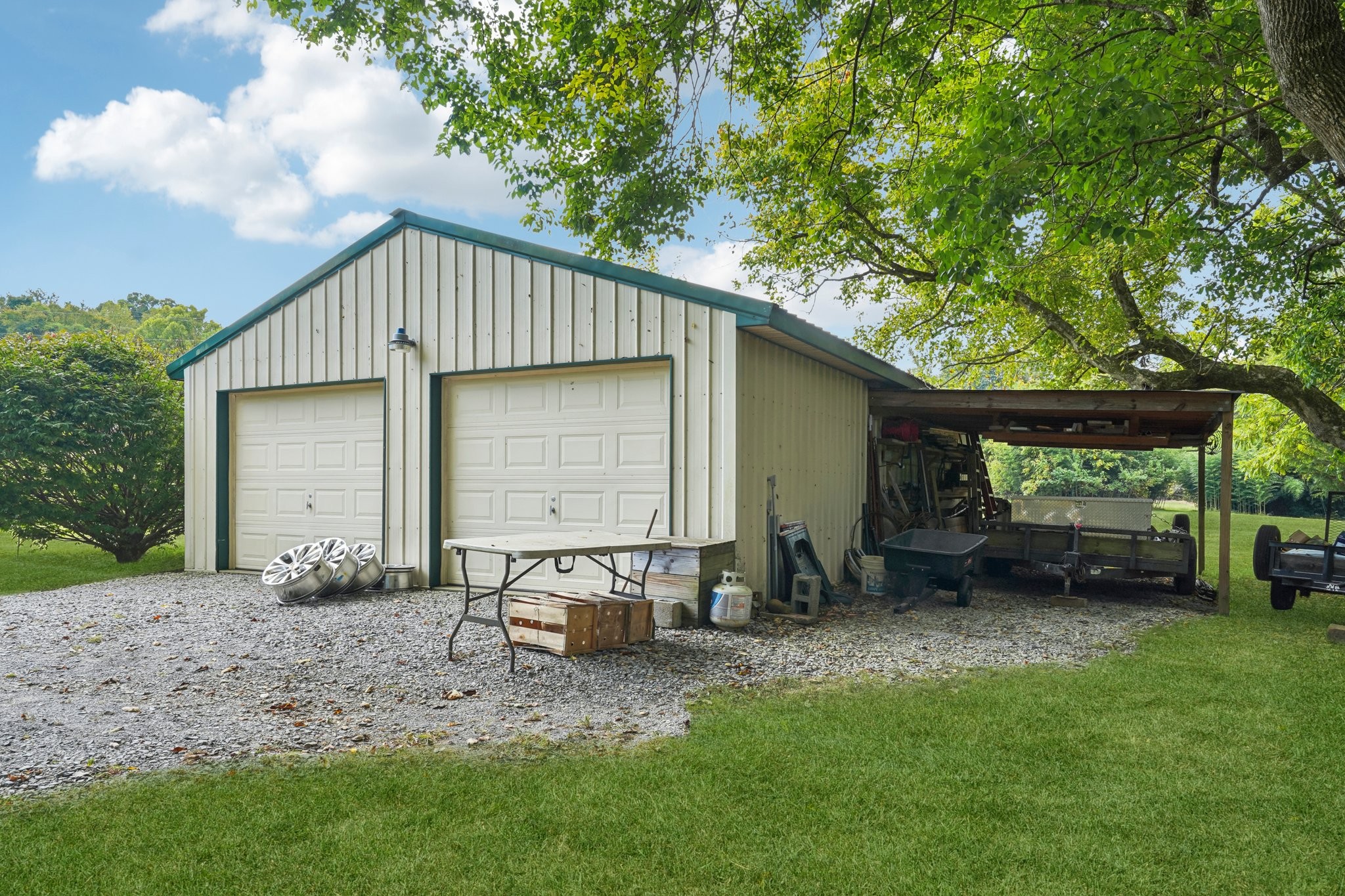 1765 Williamson Branch Road Vanleer, TN 37181 - Photo 52 of 59 a backyard of a house with table and chairs