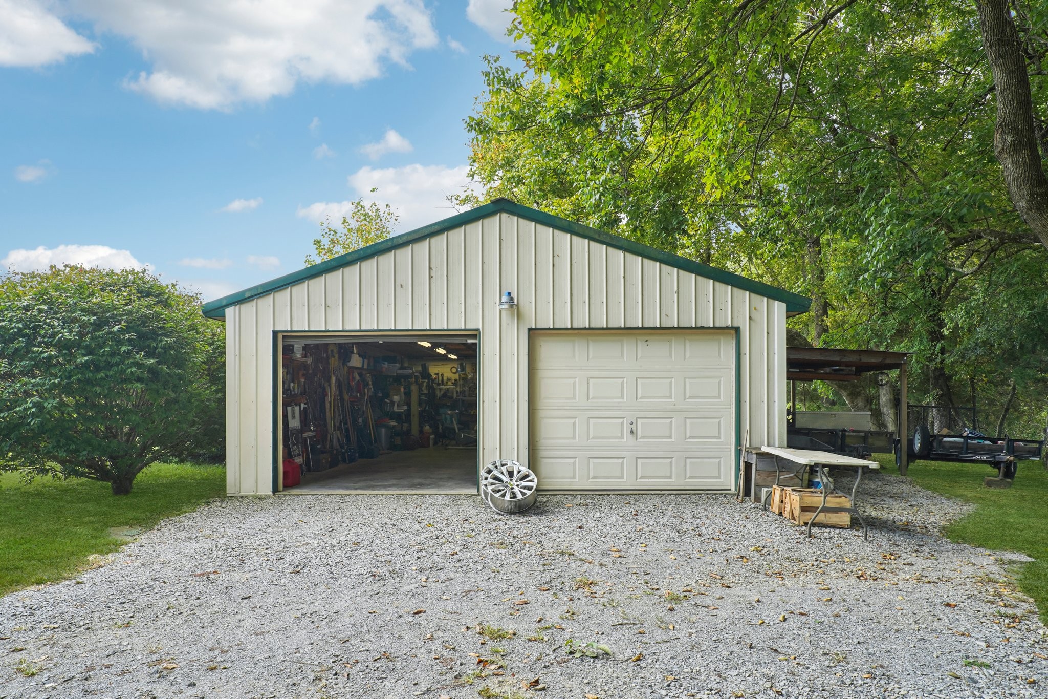 1765 Williamson Branch Road Vanleer, TN 37181 - Photo 9 of 59 a front view of a house with a yard and garage
