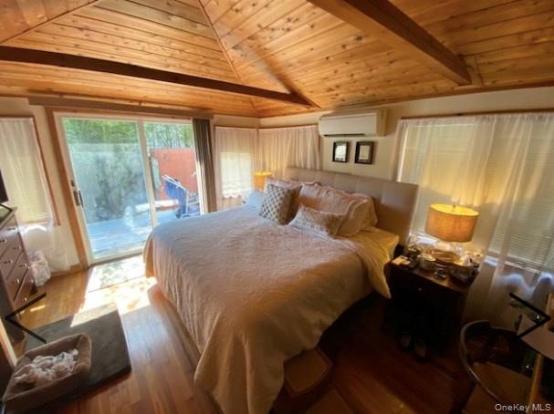 151 Ocean Road Ocean Beach, NY 11770 - Photo 12 of 19 a bedroom with a bed and wooden floor