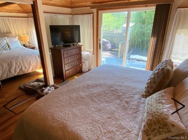 151 Ocean Road Ocean Beach, NY 11770 - Photo 14 of 19 a bedroom with a bed and a television
