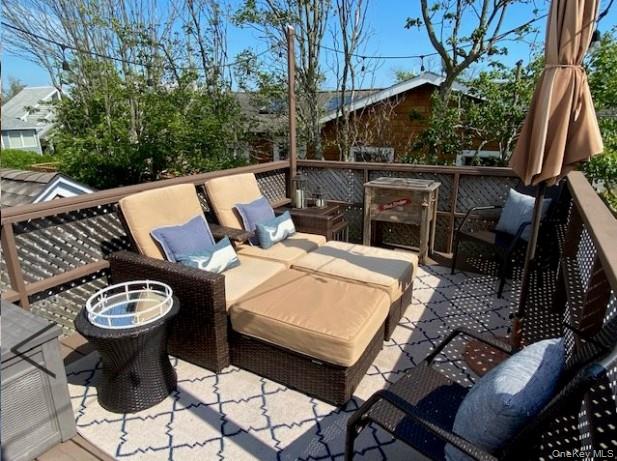 151 Ocean Road Ocean Beach, NY 11770 - Photo 18 of 19 a view of a chairs and tables in the patio