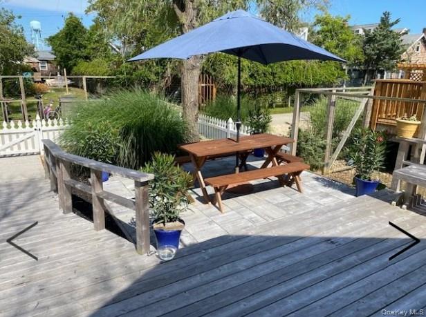 151 Ocean Road Ocean Beach, NY 11770 - Photo 19 of 19 a backyard of a house with wooden floor yard fire pit and patio