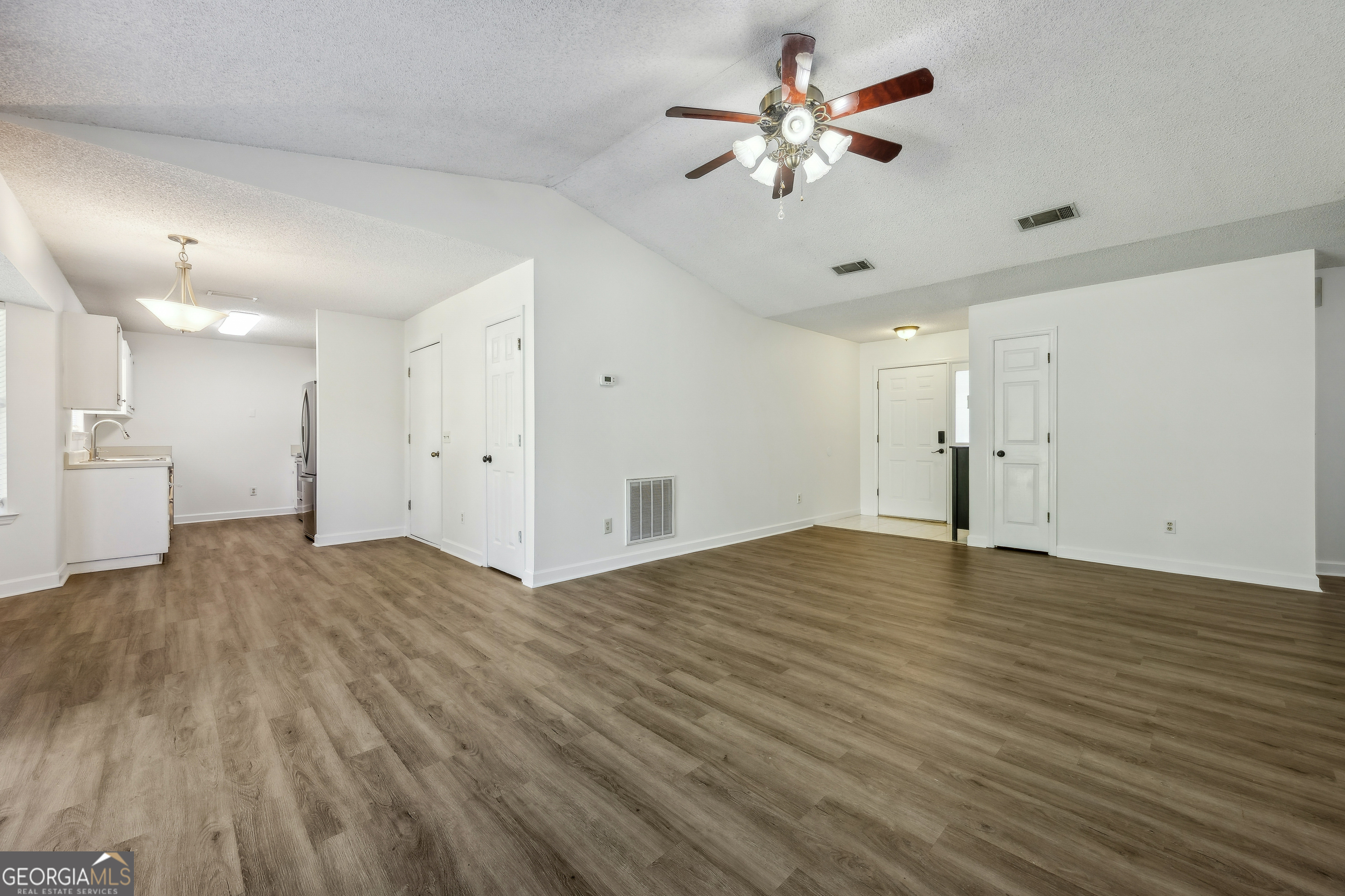 114 Colony Pines Drive Kingsland, GA 31548 - Photo 12 of 47 a view of an empty room and chandelier fan