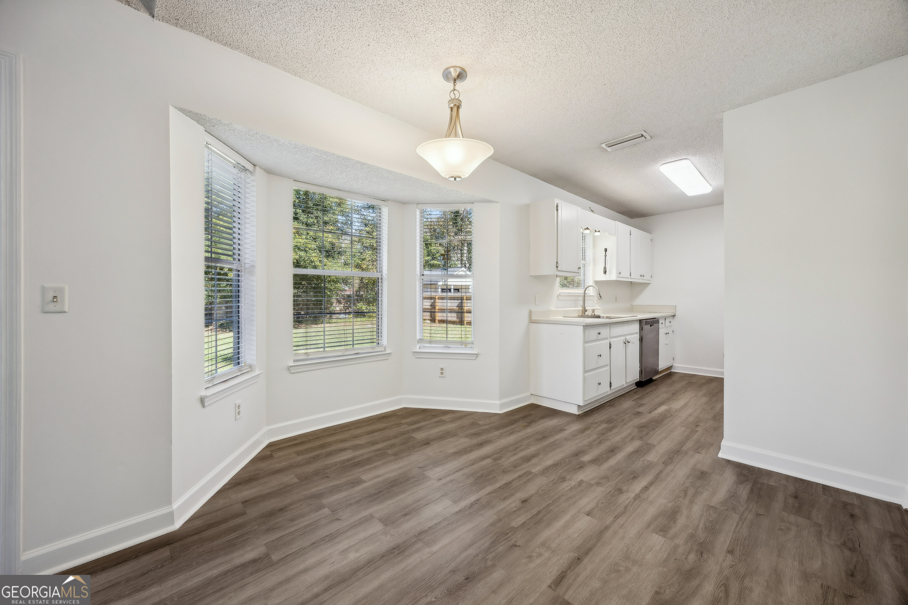 114 Colony Pines Drive Kingsland, GA 31548 - Photo 14 of 47 a view of kitchen with wooden floor and window