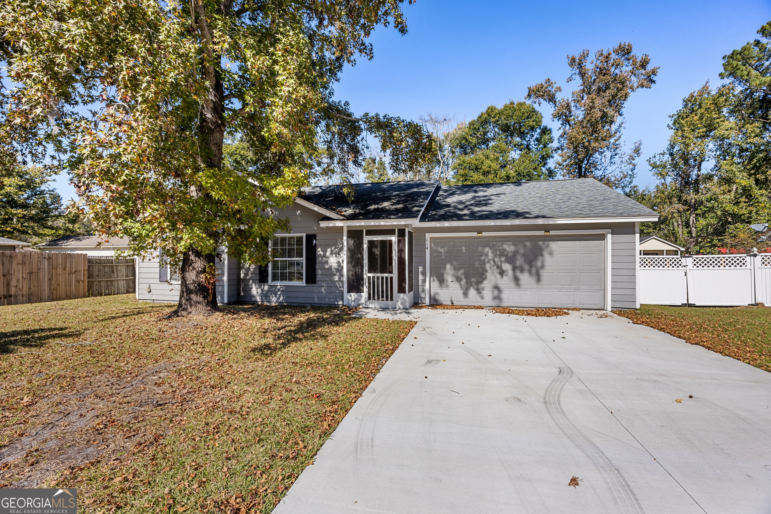 114 Colony Pines Drive Kingsland, GA 31548 - Photo 2 of 47 a front view of a house with a yard and garage
