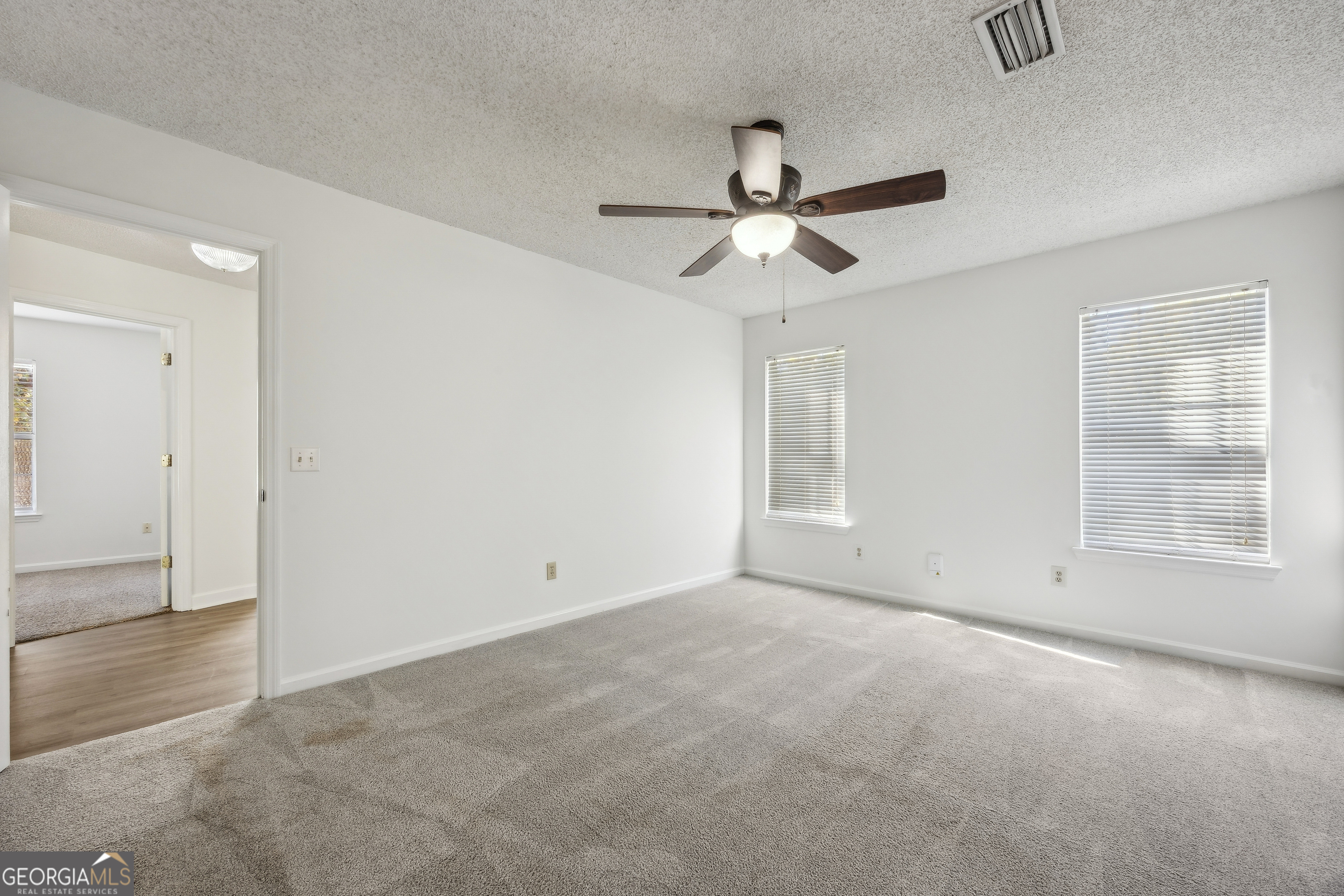 114 Colony Pines Drive Kingsland, GA 31548 - Photo 25 of 47 an empty room with fan and windows