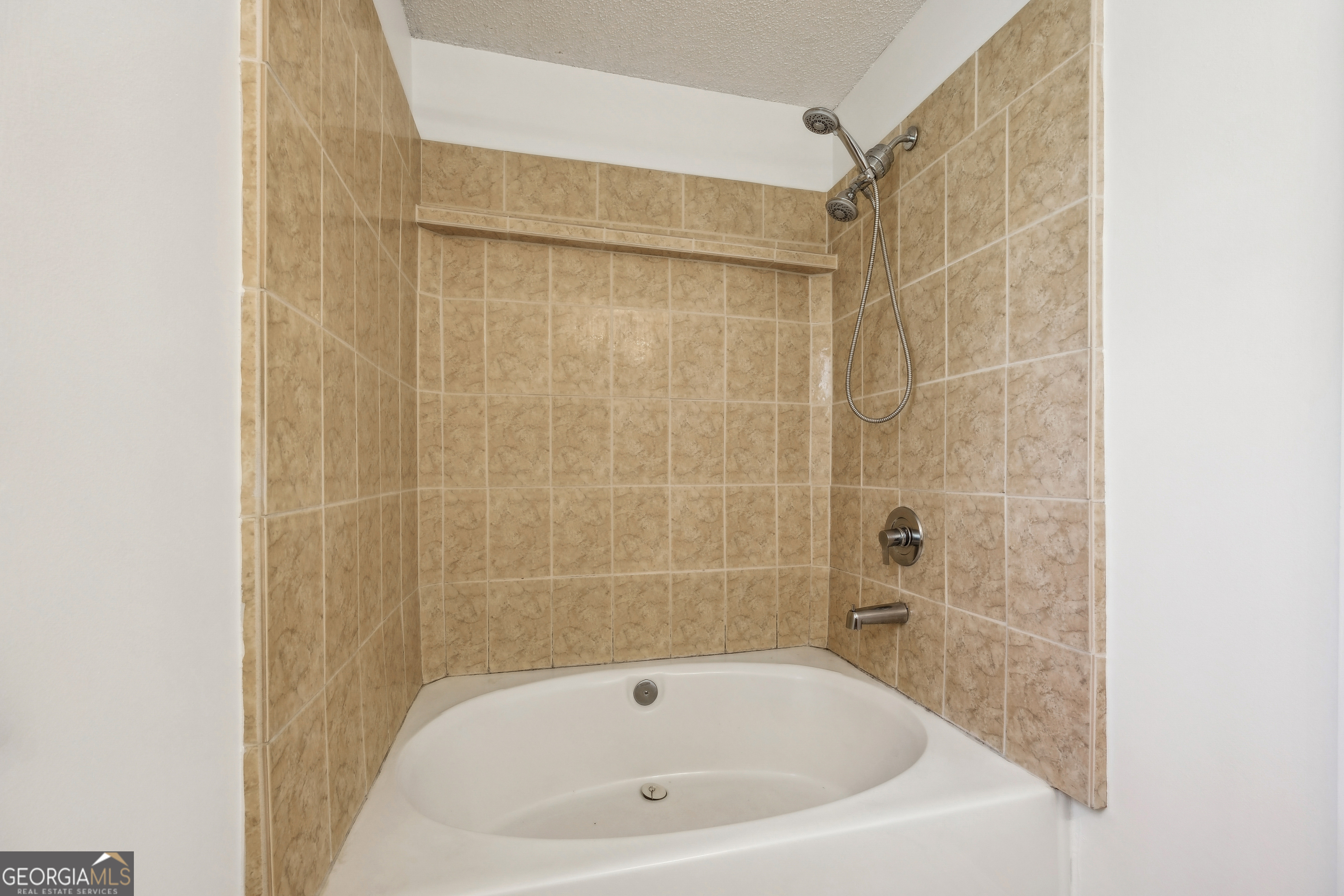 114 Colony Pines Drive Kingsland, GA 31548 - Photo 29 of 47 a bathroom with a white bath tub and shower