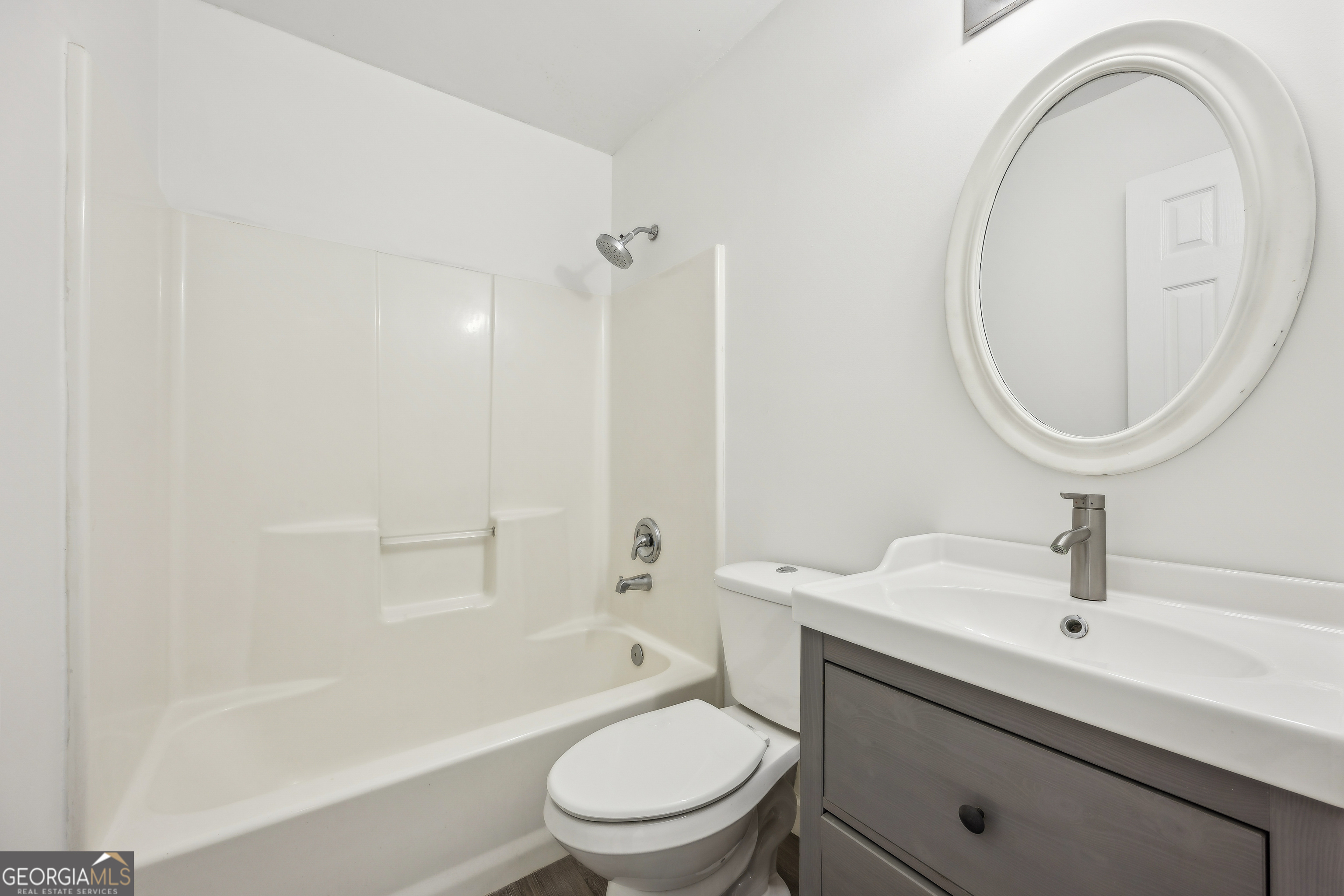 114 Colony Pines Drive Kingsland, GA 31548 - Photo 33 of 47 a bathroom with a sink a toilet and a mirror