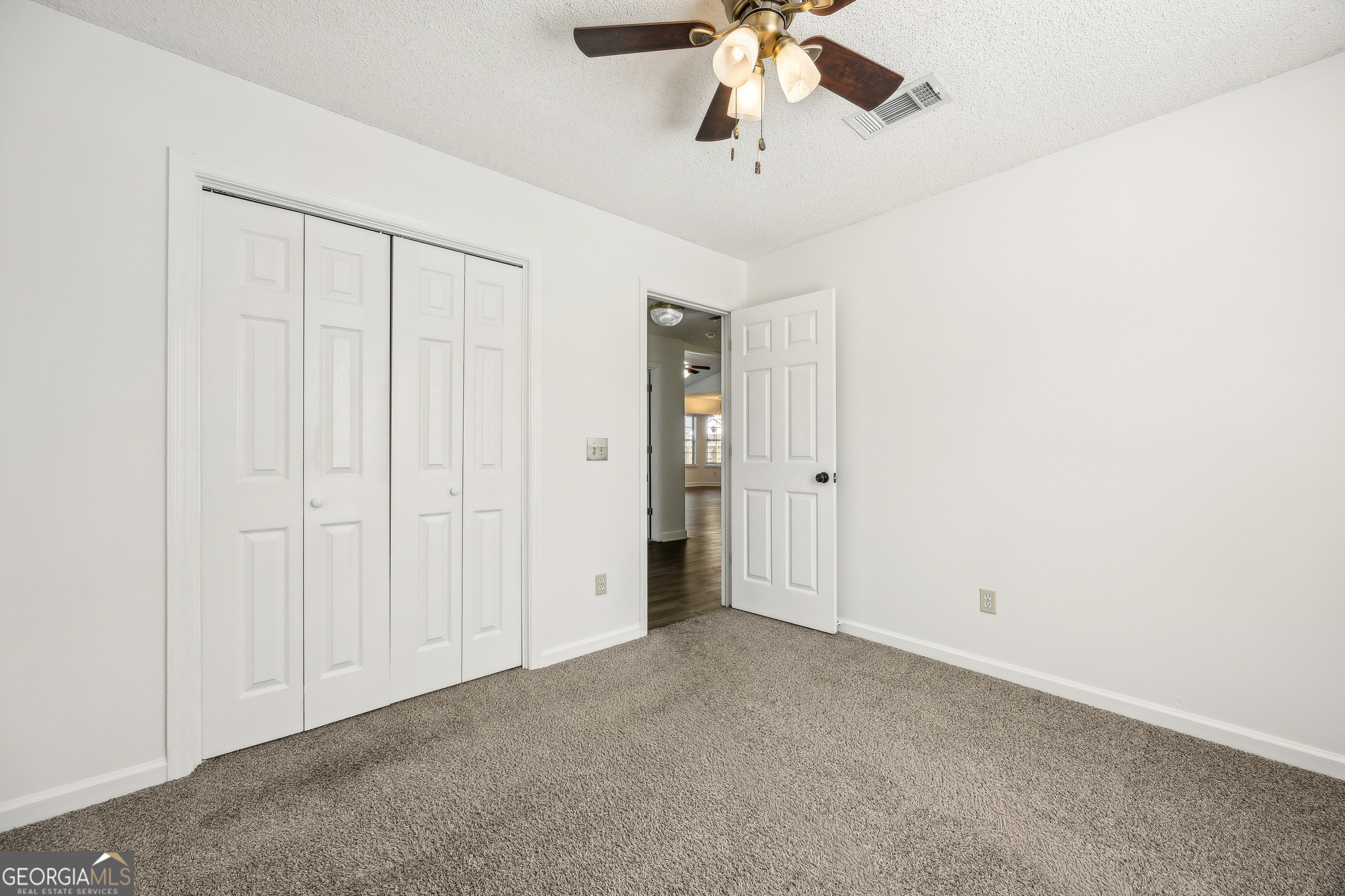 114 Colony Pines Drive Kingsland, GA 31548 - Photo 35 of 47 an empty room with a chandelier fan