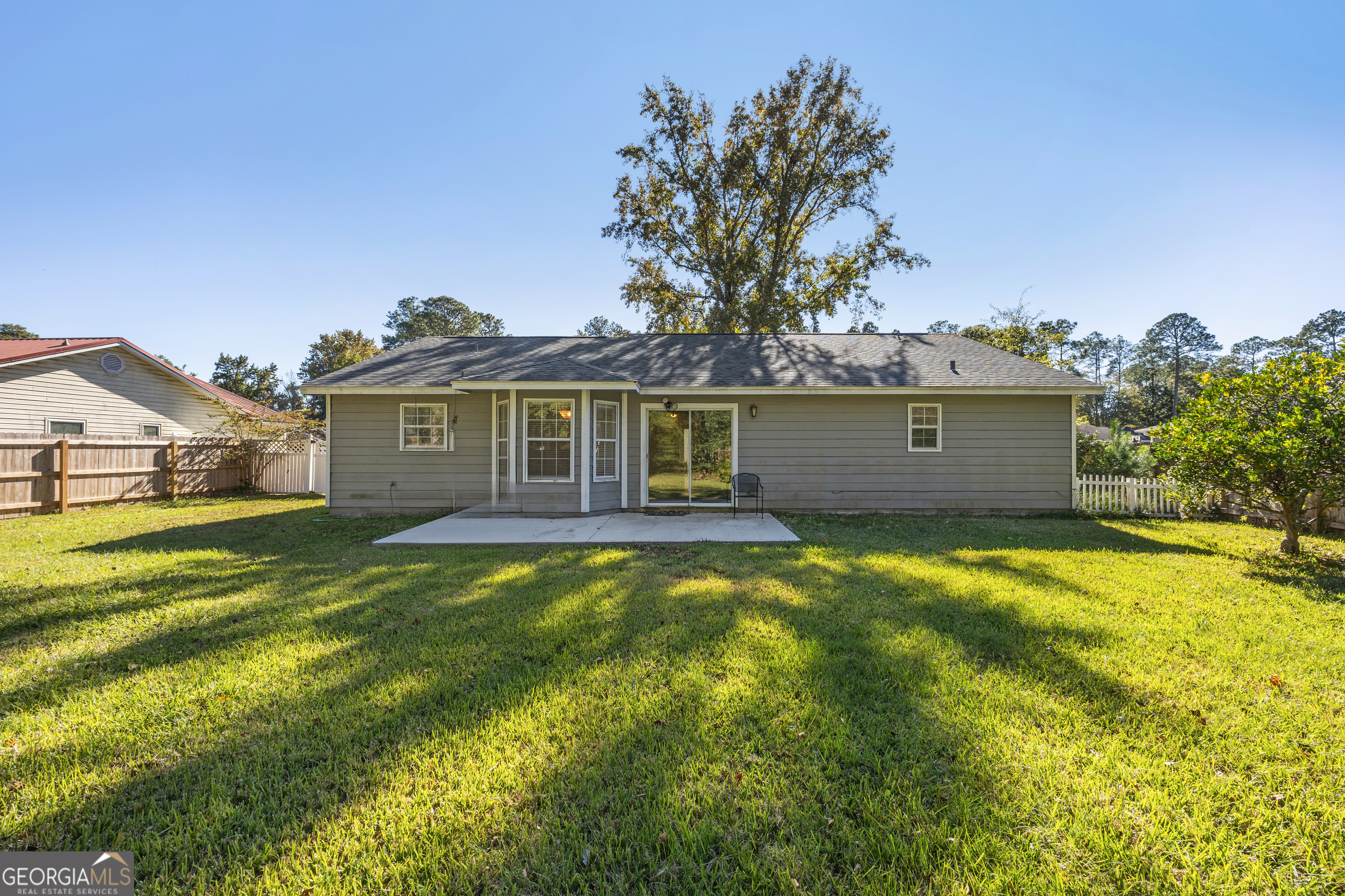 114 Colony Pines Drive Kingsland, GA 31548 - Photo 41 of 47 a front view of a house with a garden