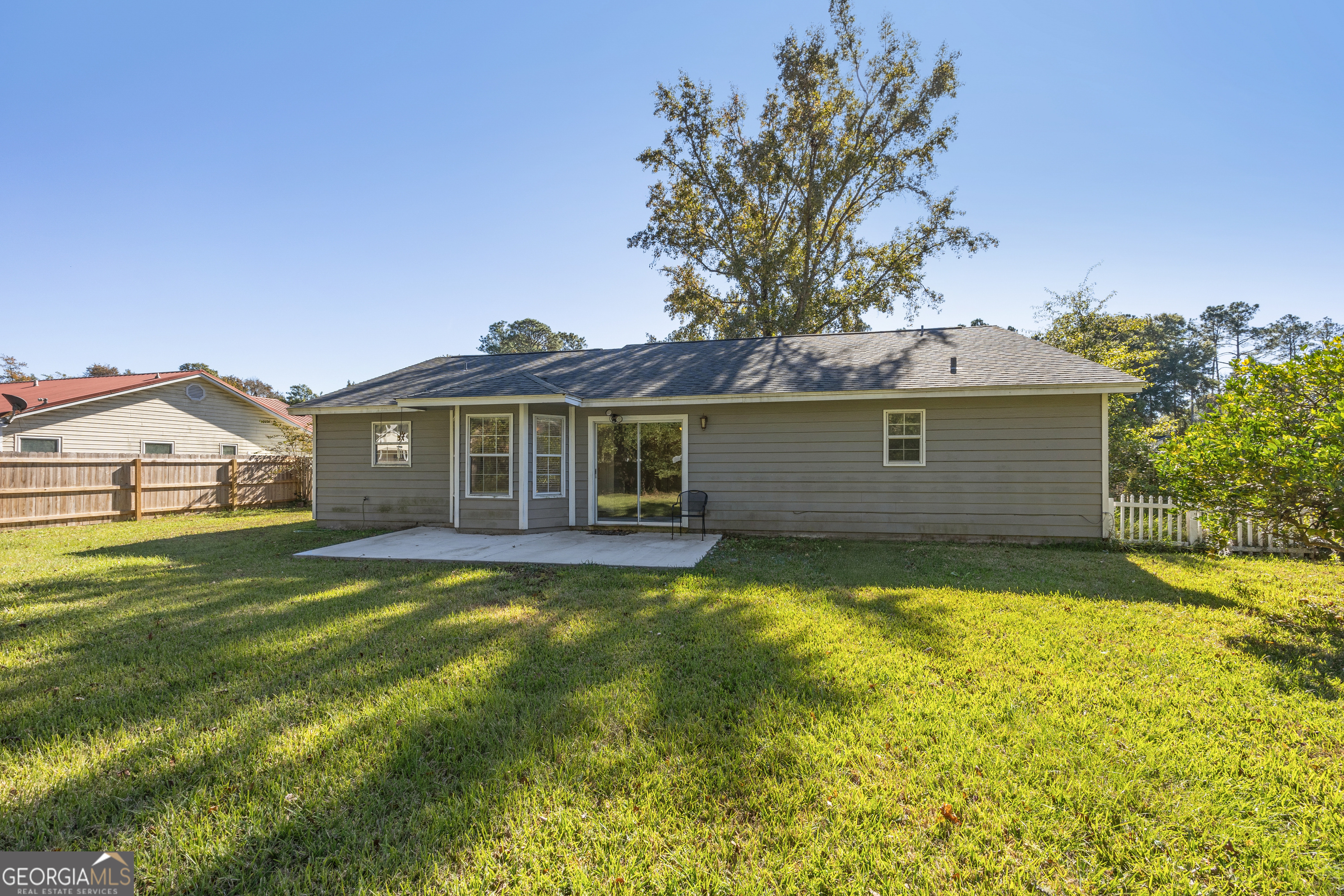 114 Colony Pines Drive Kingsland, GA 31548 - Photo 42 of 47 a view of a yard with a house in the background