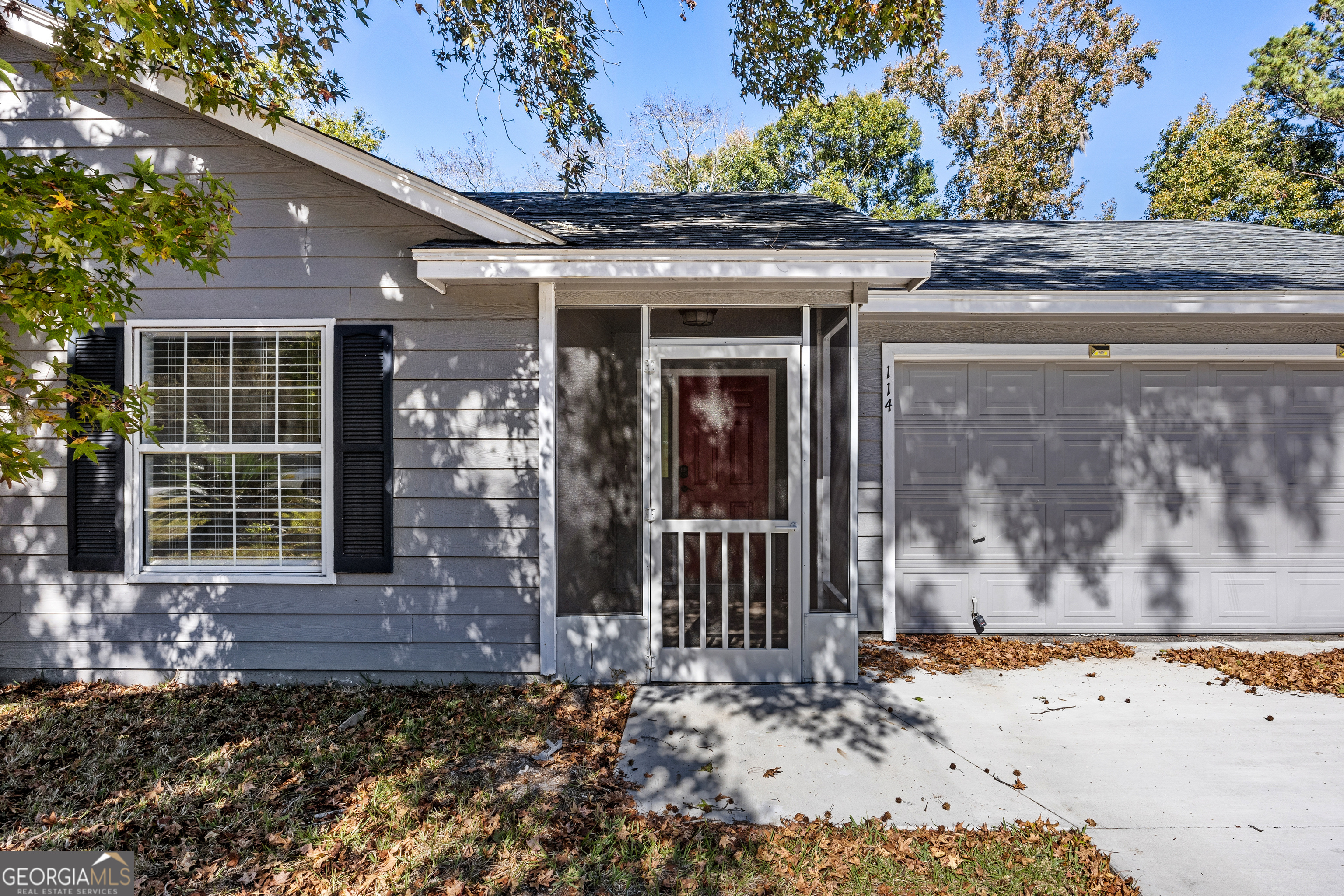 114 Colony Pines Drive Kingsland, GA 31548 - Photo 5 of 47 a front view of a house with a tree