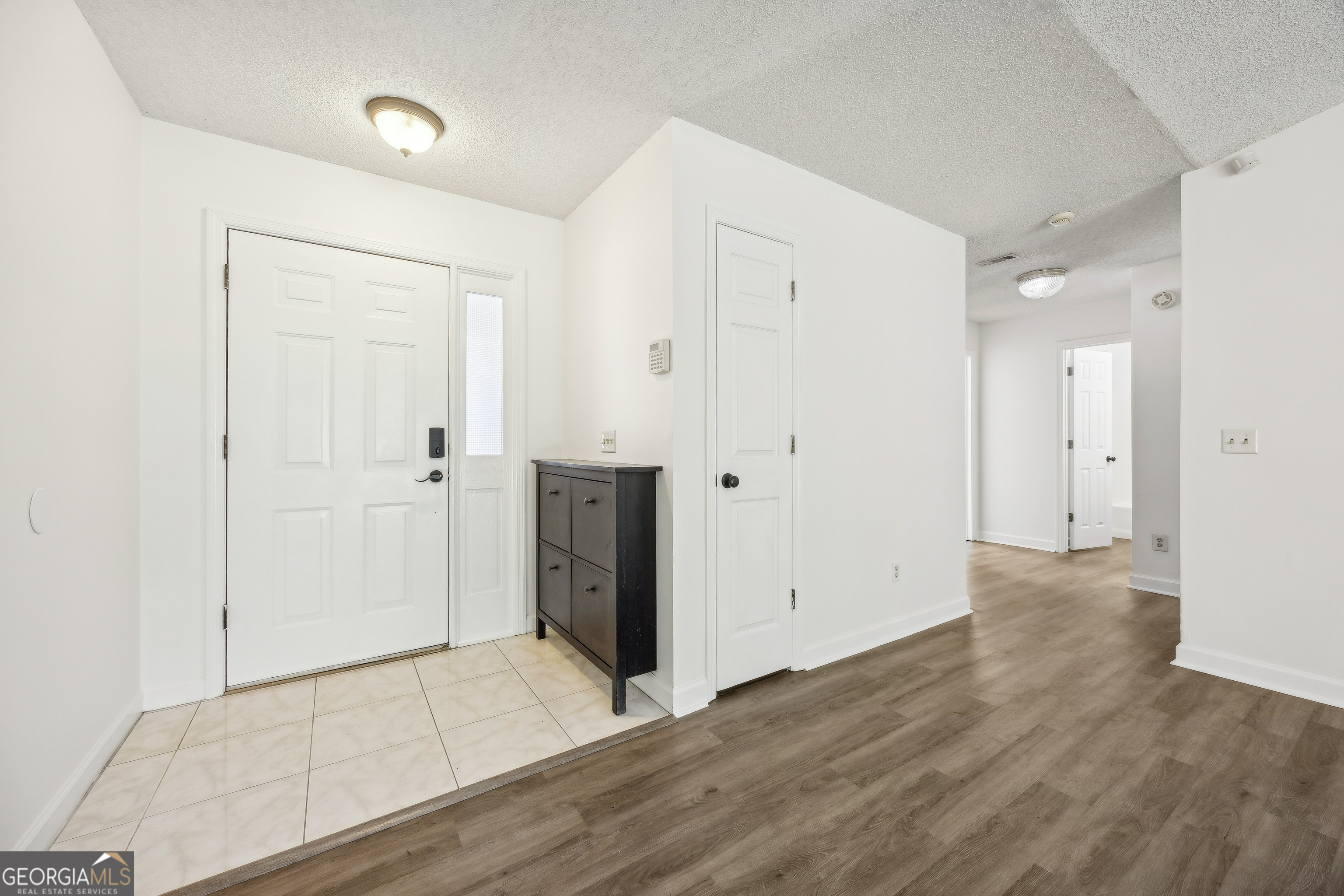 114 Colony Pines Drive Kingsland, GA 31548 - Photo 9 of 47 an empty room with wooden floor