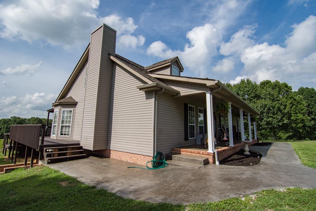 2195 Darrell Rye Road Erin, TN 37061 - Photo 5 of 26 Stamped Concrete around front and sides of home