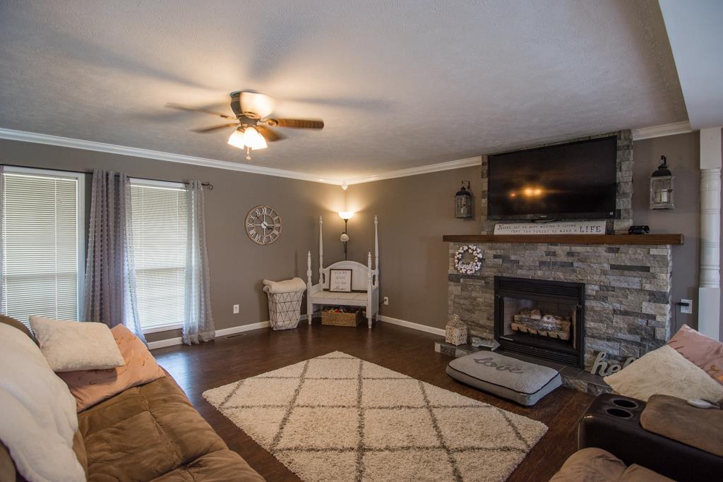 2195 Darrell Rye Road Erin, TN 37061 - Photo 7 of 26 Great Room with Stone Fireplace and Natural Lighting