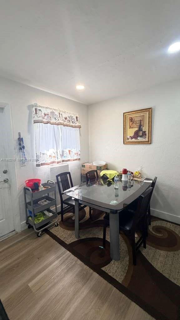 673 West 30th Street, Unit 671 Hialeah, FL 33012 - Photo 12 of 19 a living room with furniture pool table and paintings on the wall