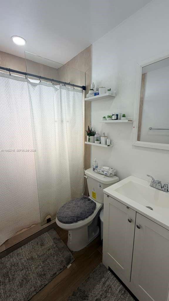 673 West 30th Street, Unit 671 Hialeah, FL 33012 - Photo 14 of 19 a bathroom with a sink toilet and shower