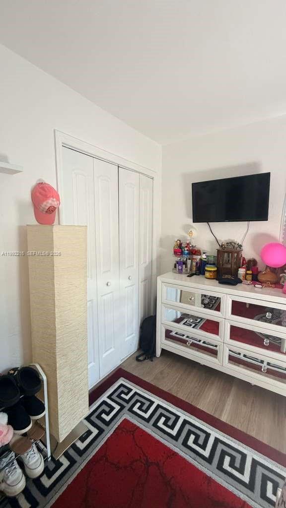 673 West 30th Street, Unit 671 Hialeah, FL 33012 - Photo 16 of 19 a bedroom with a bed and a window