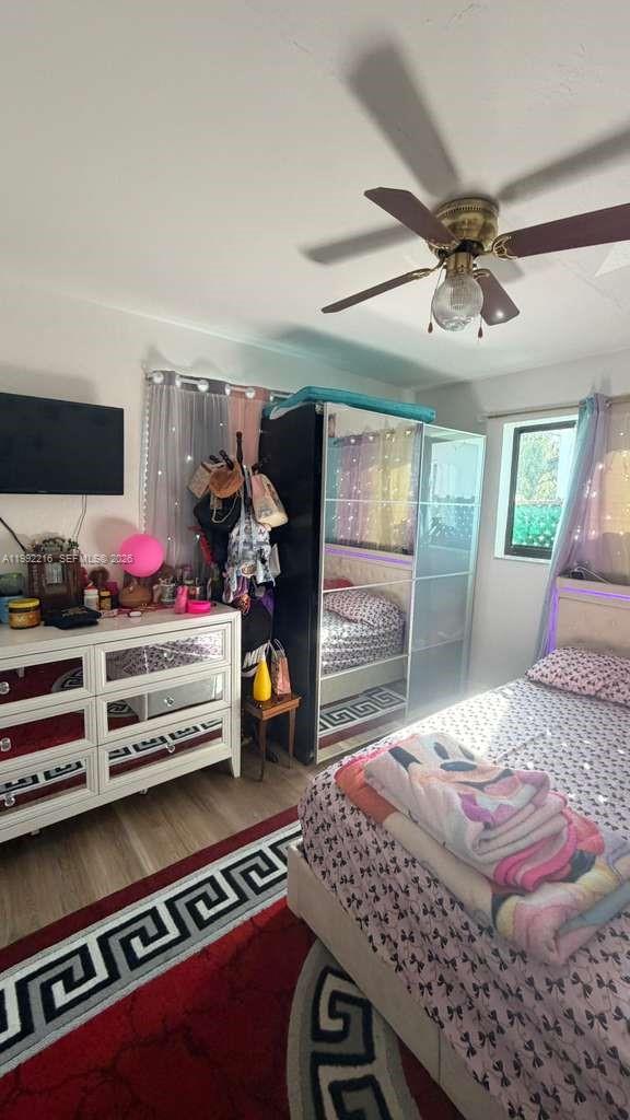 673 West 30th Street, Unit 671 Hialeah, FL 33012 - Photo 17 of 19 a bedroom with a bed and large windows
