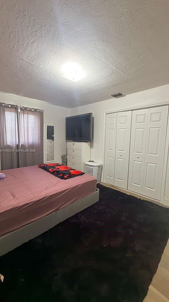 673 West 30th Street, Unit 671 Hialeah, FL 33012 - Photo 18 of 19 a bed room with a bed