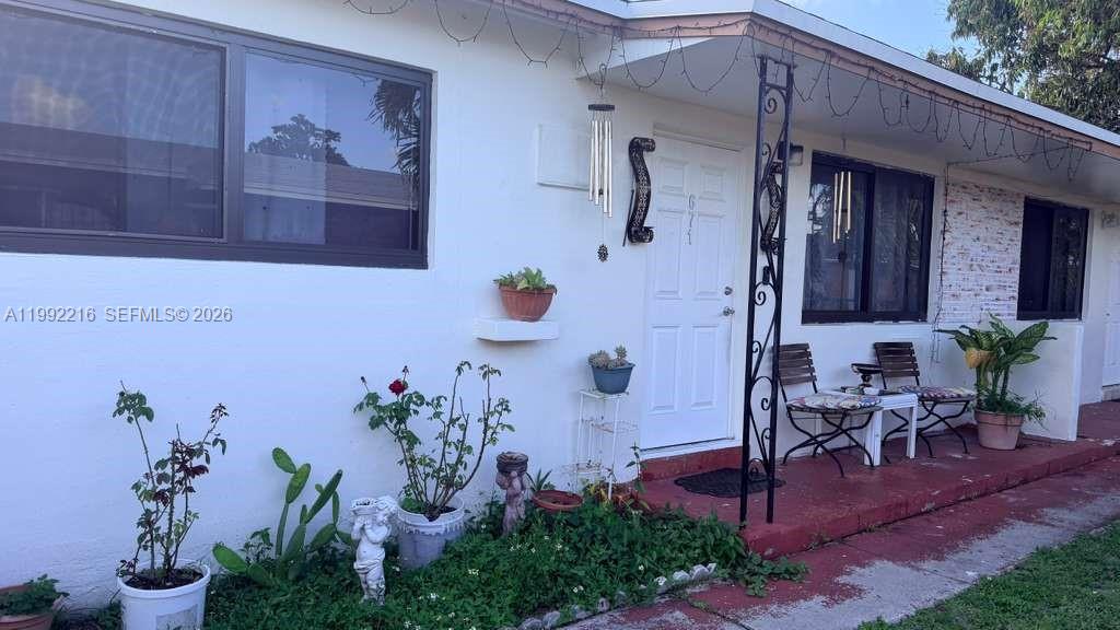 673 West 30th Street, Unit 671 Hialeah, FL 33012 - Photo 3 of 19 a view of a porch with seating space