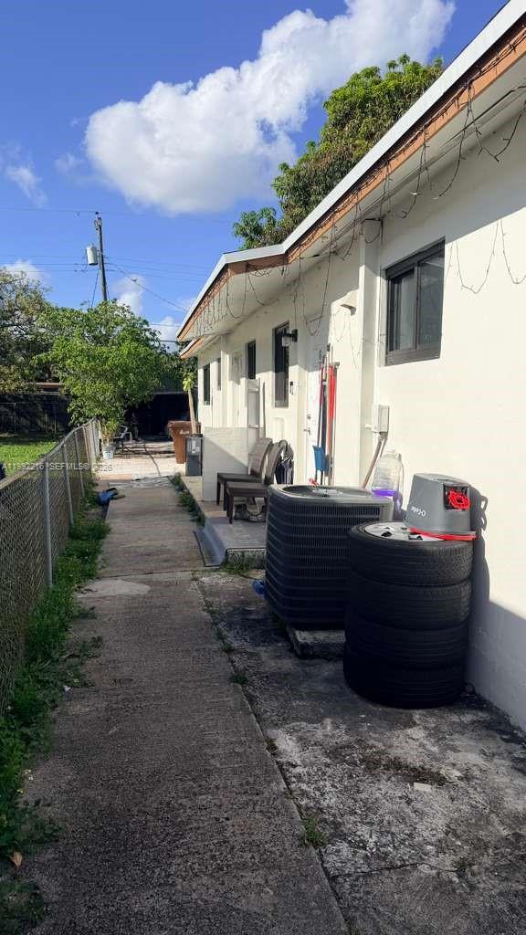 673 West 30th Street, Unit 671 Hialeah, FL 33012 - Photo 7 of 19 a front view of a house with a yard