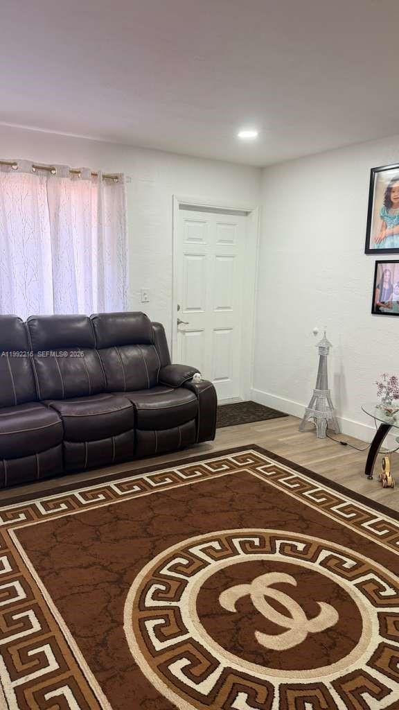 673 West 30th Street, Unit 671 Hialeah, FL 33012 - Photo 8 of 19 a living room with furniture and a window