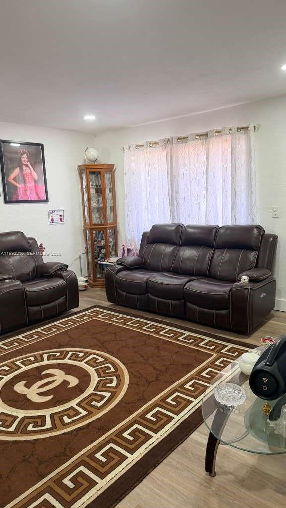 673 West 30th Street, Unit 671 Hialeah, FL 33012 - Photo 10 of 19 a living room with furniture and a couch