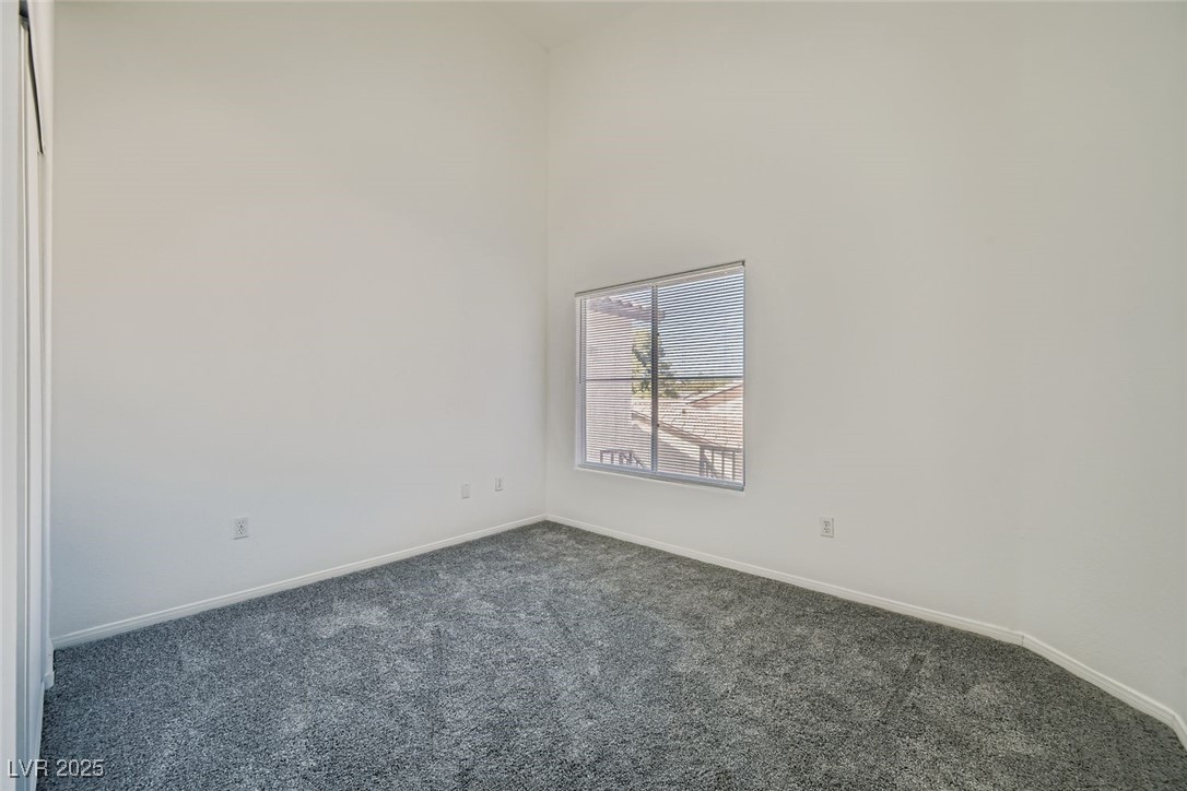 4941 Black Bear Road, Unit 203 Las Vegas, NV 89149 - Photo 9 of 11 2nd bedroom with carpet flooring, different view
