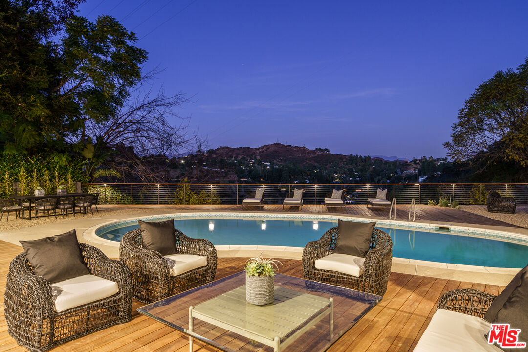 a view of a swimming pool with lounge chairs