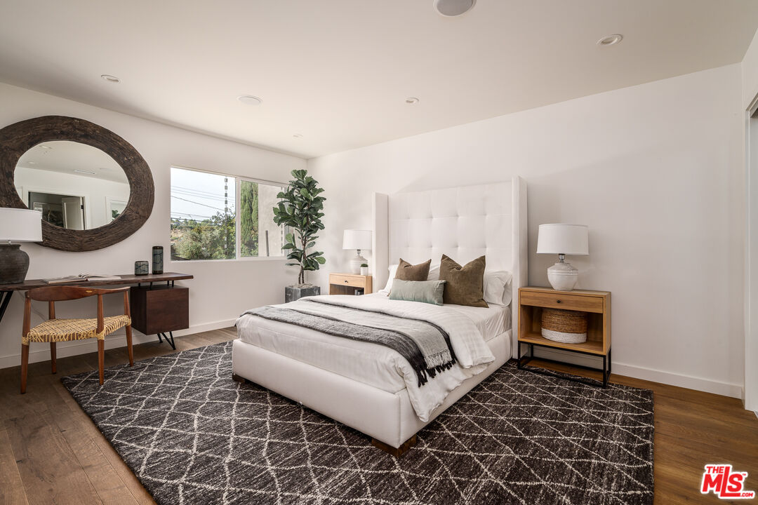 2658 Carmar Drive Los Angeles, CA 90046 - Photo 20 of 29 a bedroom with bed and a large window