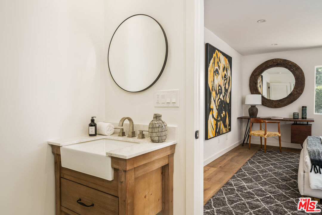 2658 Carmar Drive Los Angeles, CA 90046 - Photo 22 of 29 a bathroom with a sink and a mirror