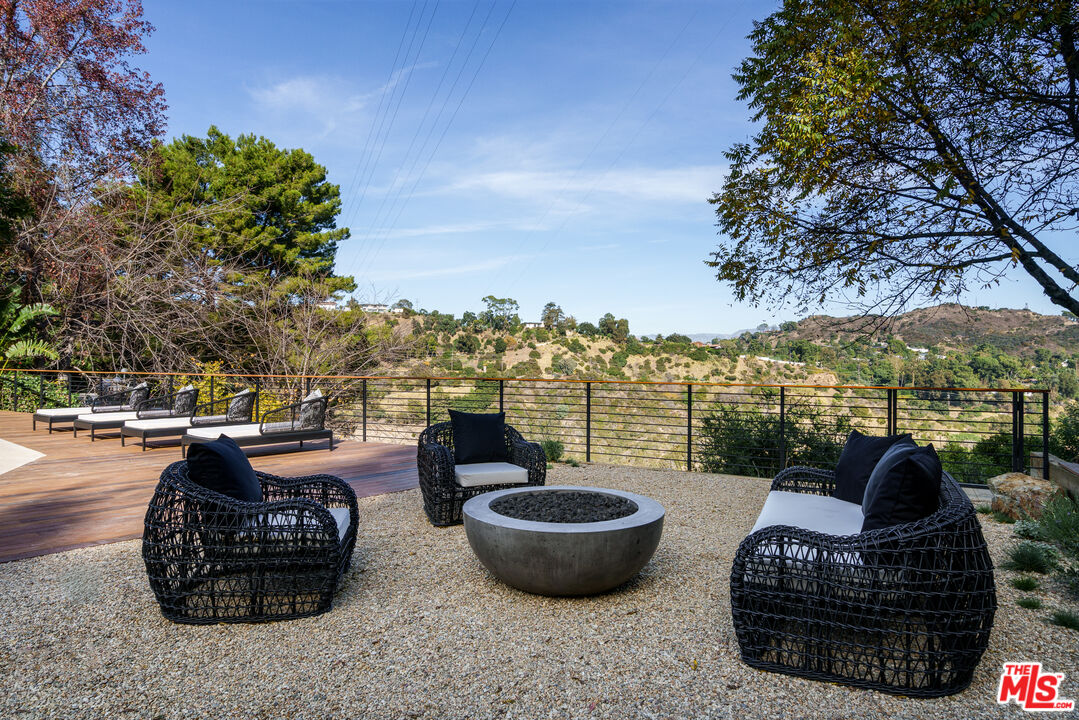 2658 Carmar Drive Los Angeles, CA 90046 - Photo 25 of 29 a view of a roof deck with couches and potted plants