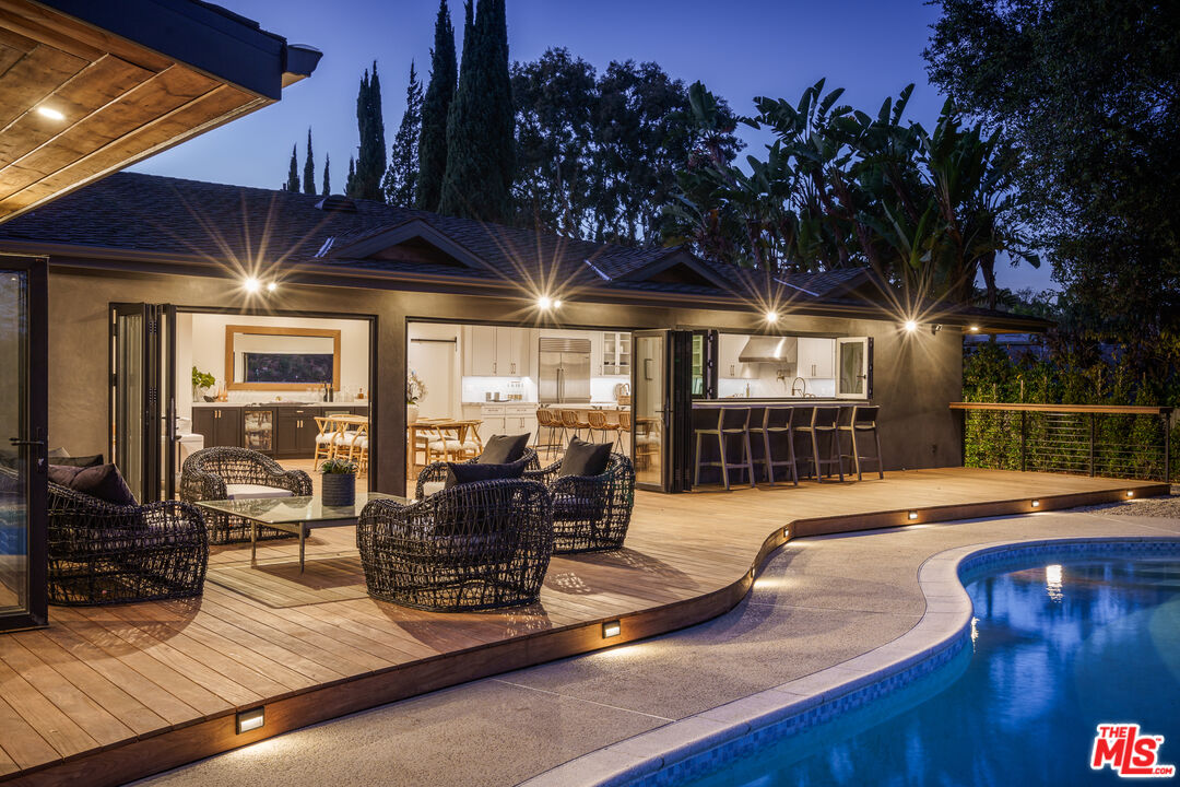 2658 Carmar Drive Los Angeles, CA 90046 - Photo 26 of 29 a view of a house with pool table chairs and wooden floor